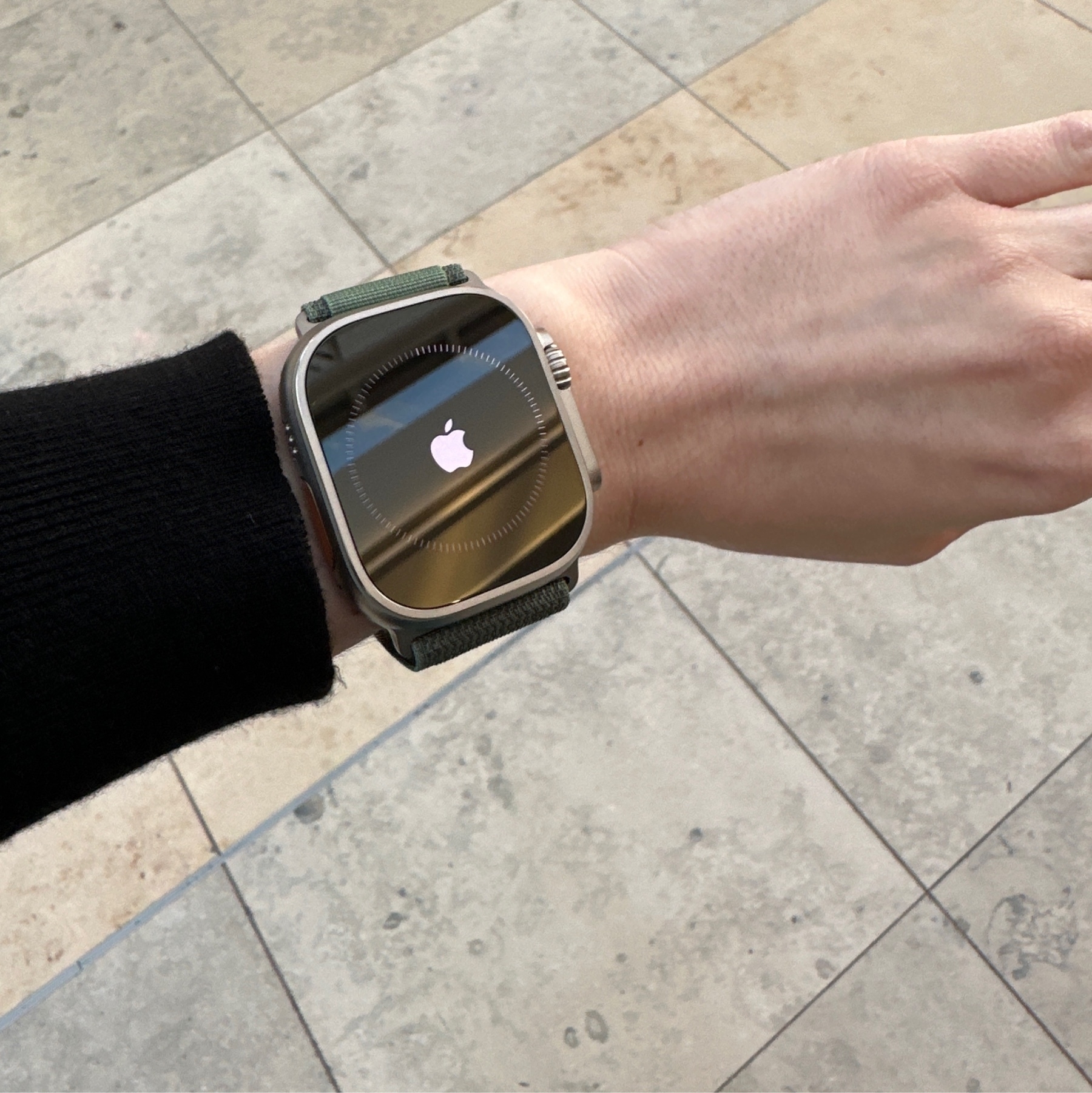 an apple watch ultra on a small wrist