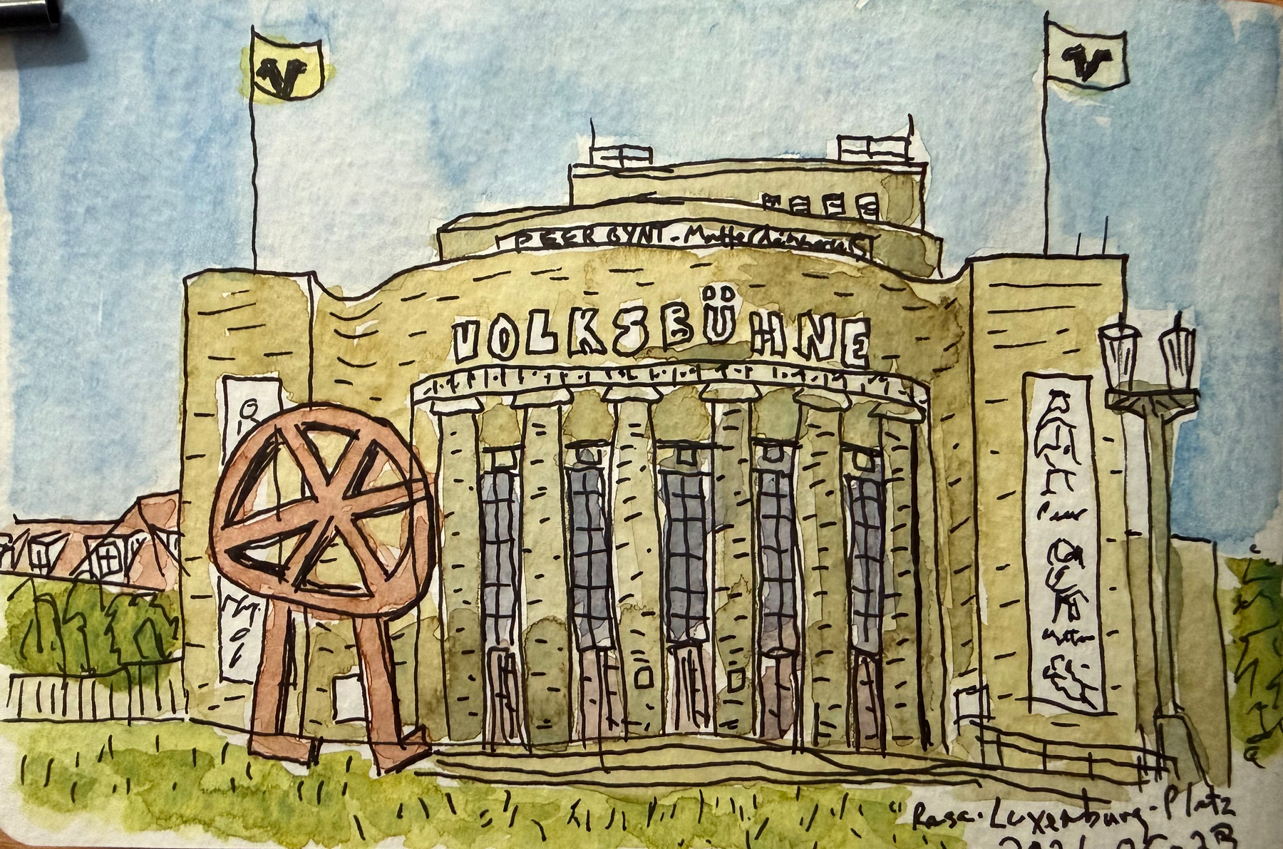A watercolor illustration depicts the Volksbühne theater with its iconic architecture, flags, and a large sculpture of its logo in front.
