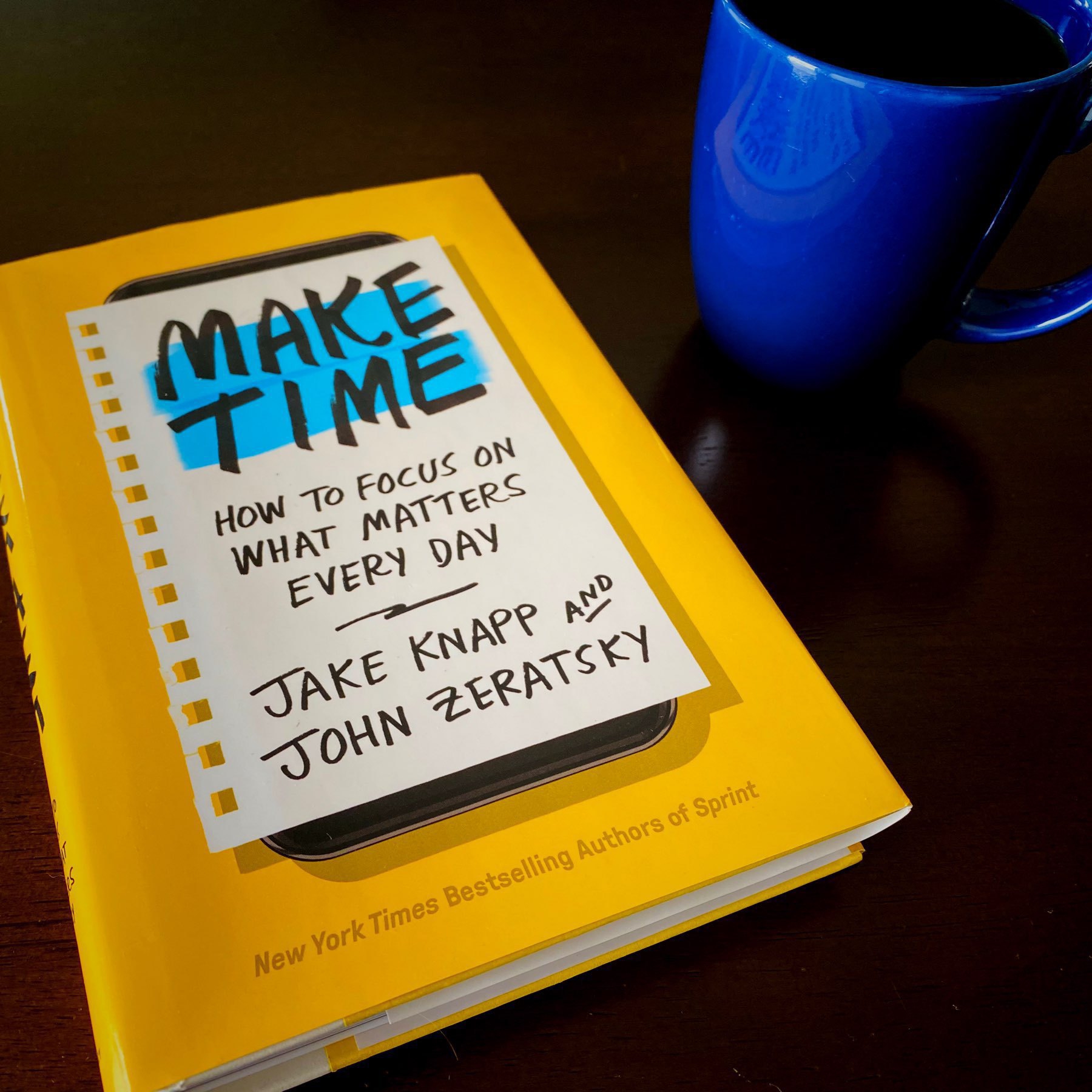 Make Time book sitting on a table next to a coffee mug