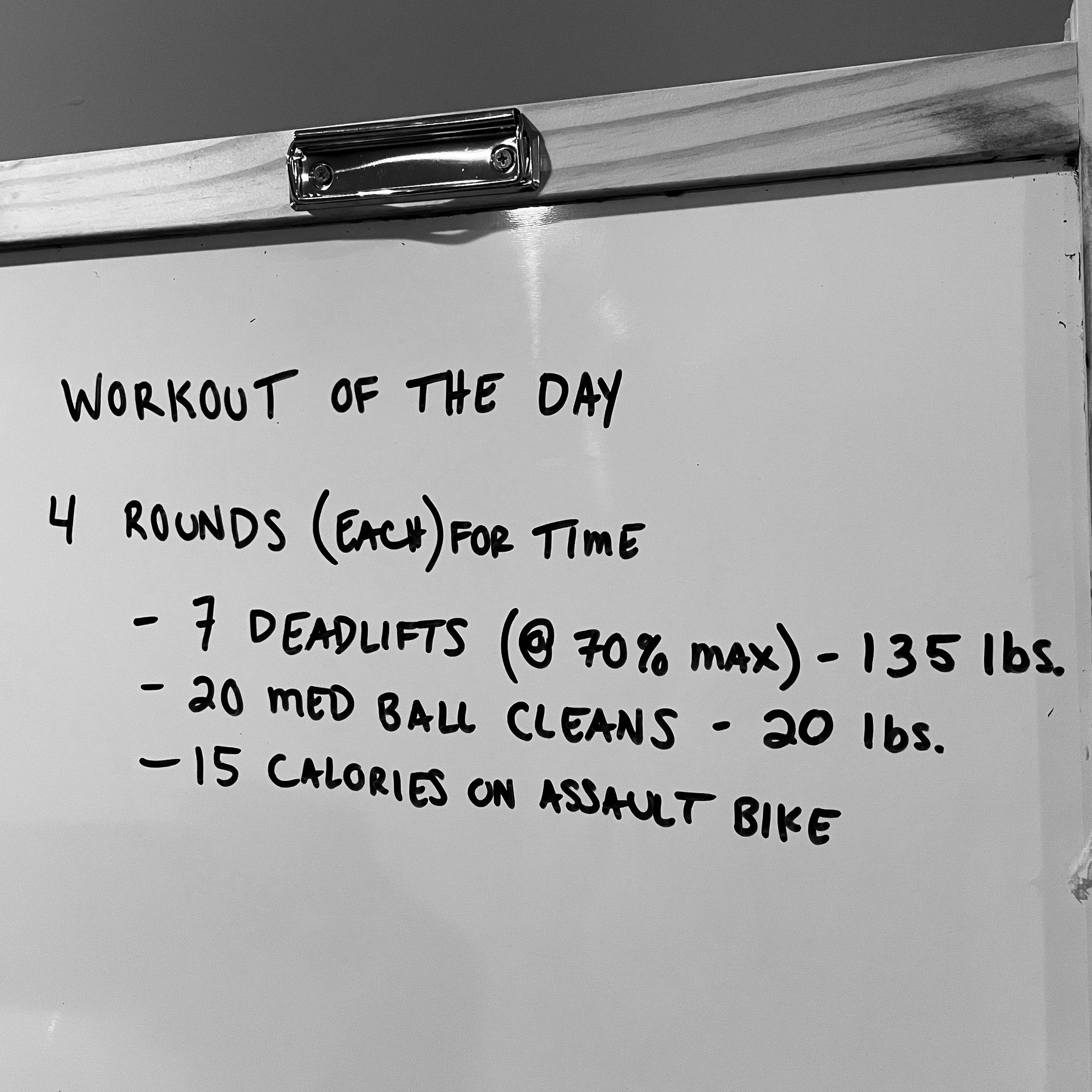 whiteboard with workout written on it