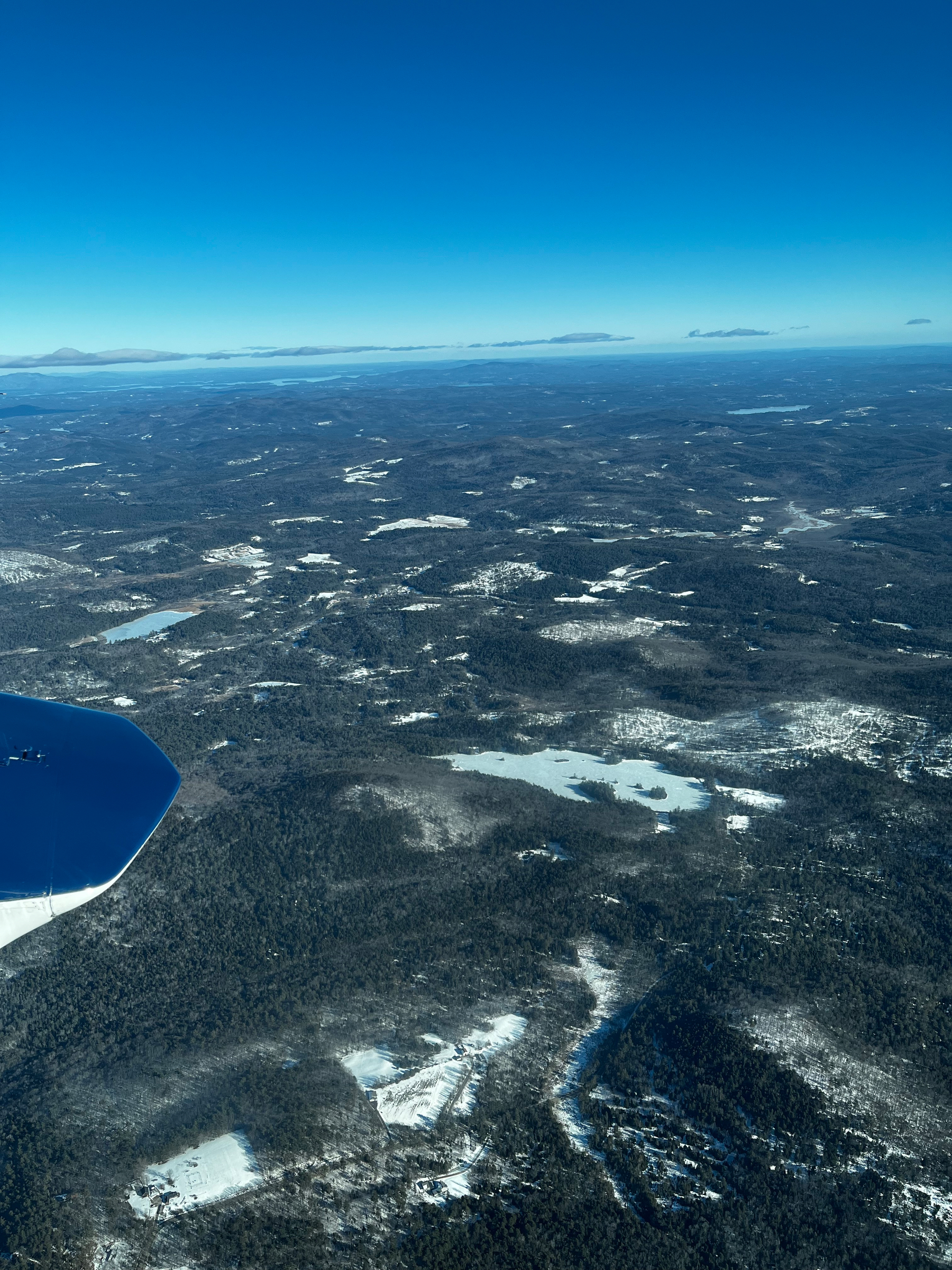 A view out the window of a Cessna 402C over New Hampshire