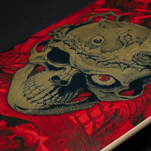 Auto-generated description: A detailed skull illustration with intricate designs and red background elements is depicted on a surface.