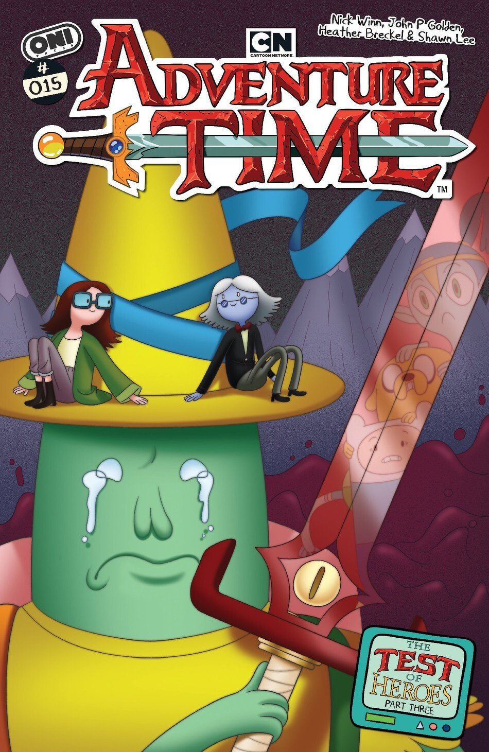 Two characters sit atop a giant, crying wizard hat, surrounded by surreal landscapes, on the cover of Adventure Time comic issue #15.