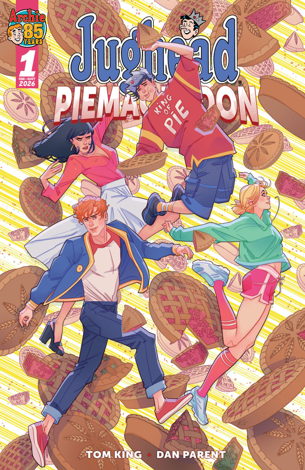 A colorful comic book cover features four characters floating amid flying pies, with one person wearing a King of Pie shirt.