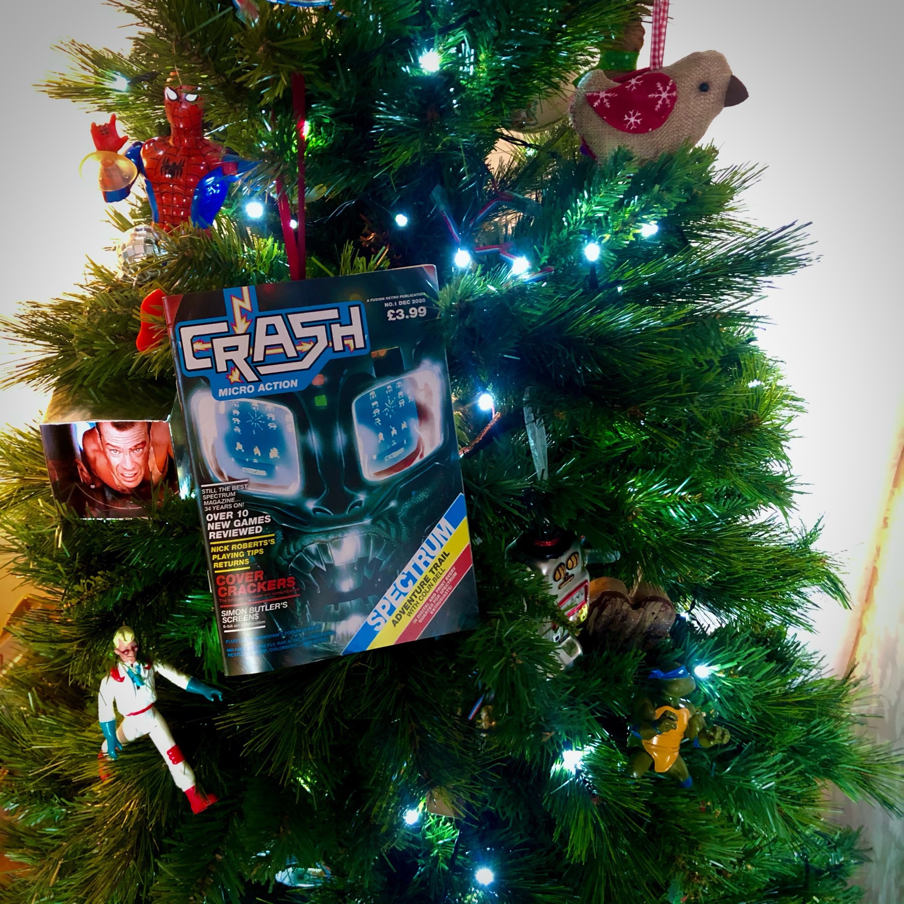 christmas tree decorated with 1980s toys and a 2020 copy of Crash magazine