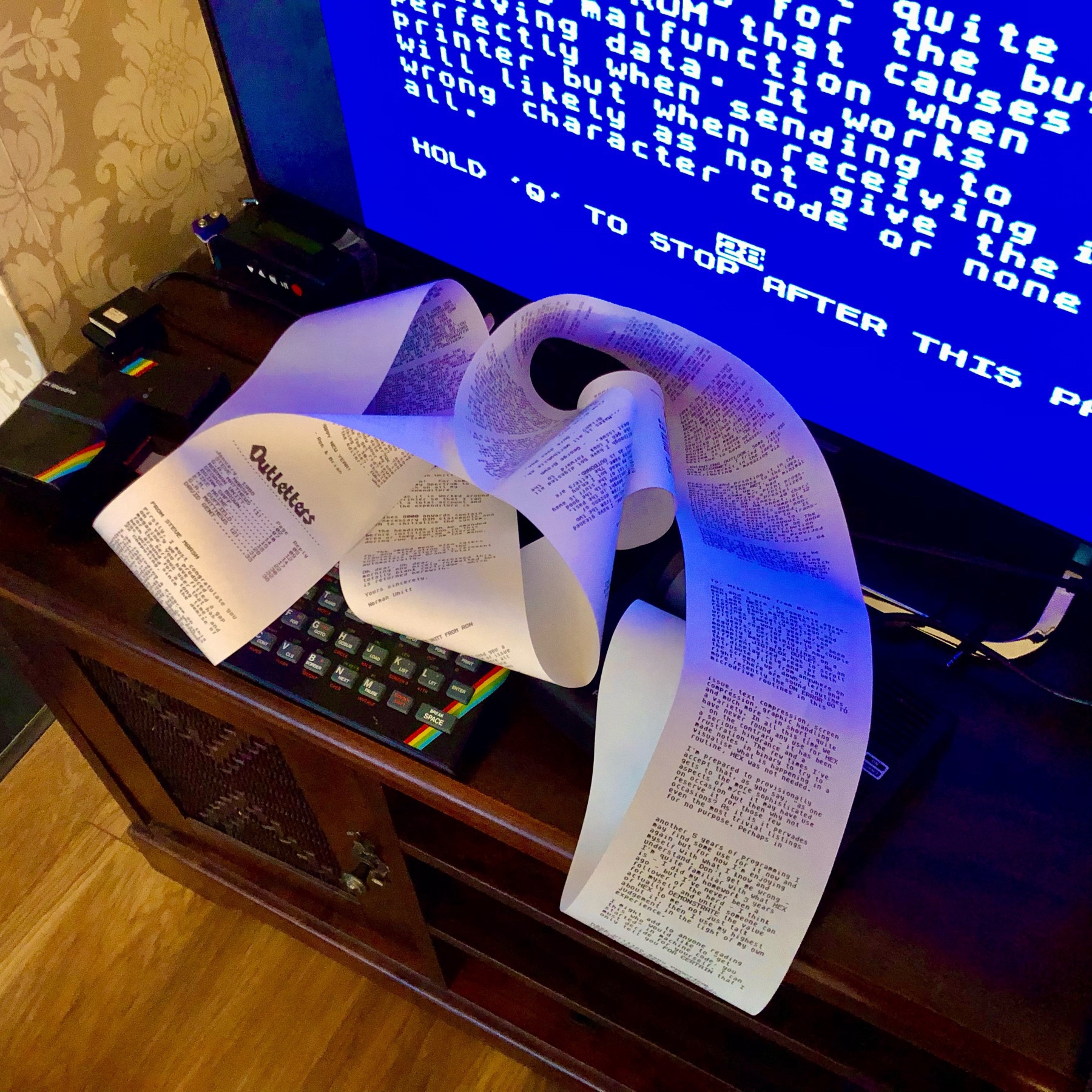 ZX Spectrum printing out on an Alphacom 32 and a long ream of thermal printer paper