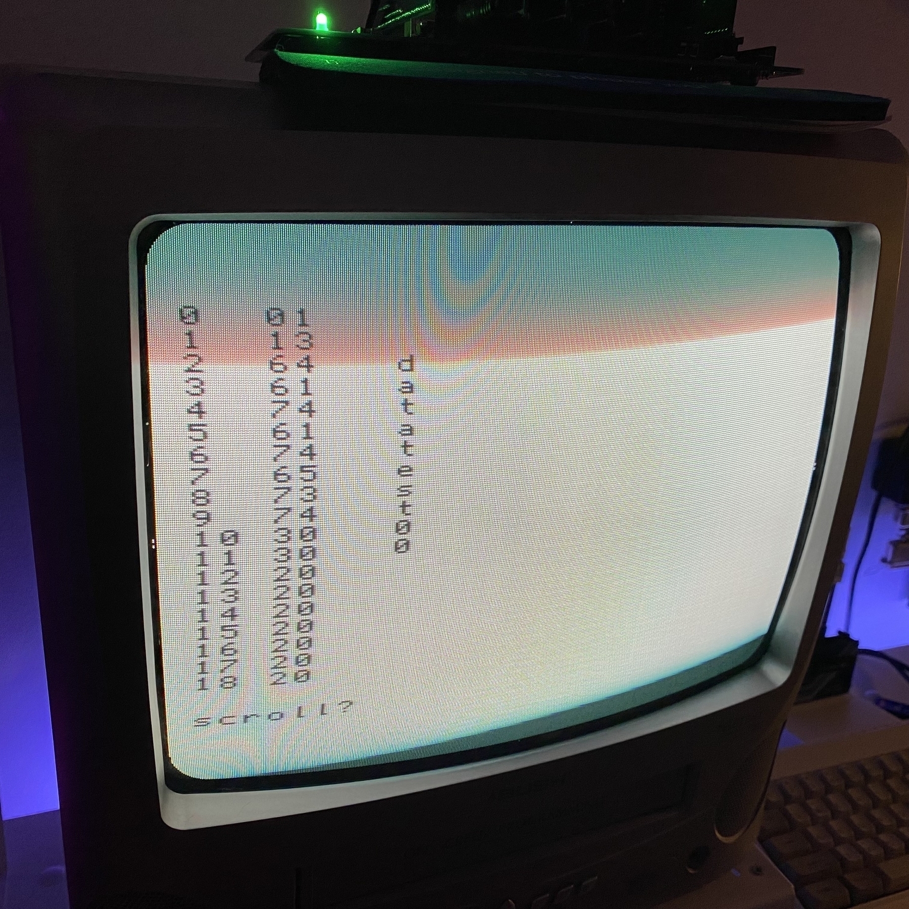 Closeup of TV screen. Three columns of information: decimal numbers, hexadecimal numbers and ASCII text