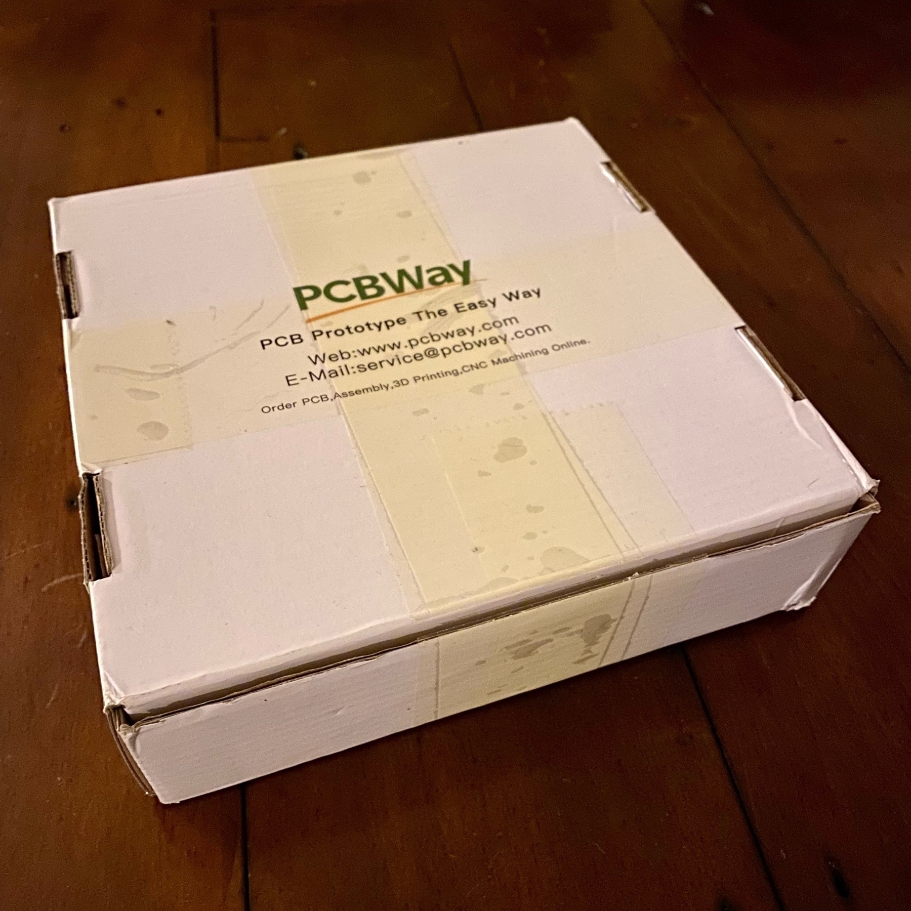 slim cardboard postage box with PCBWay branding