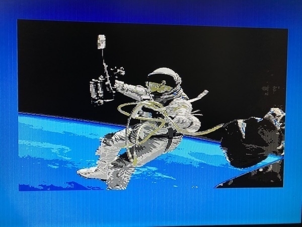 Photograph of a tv screen showing the astronaut image