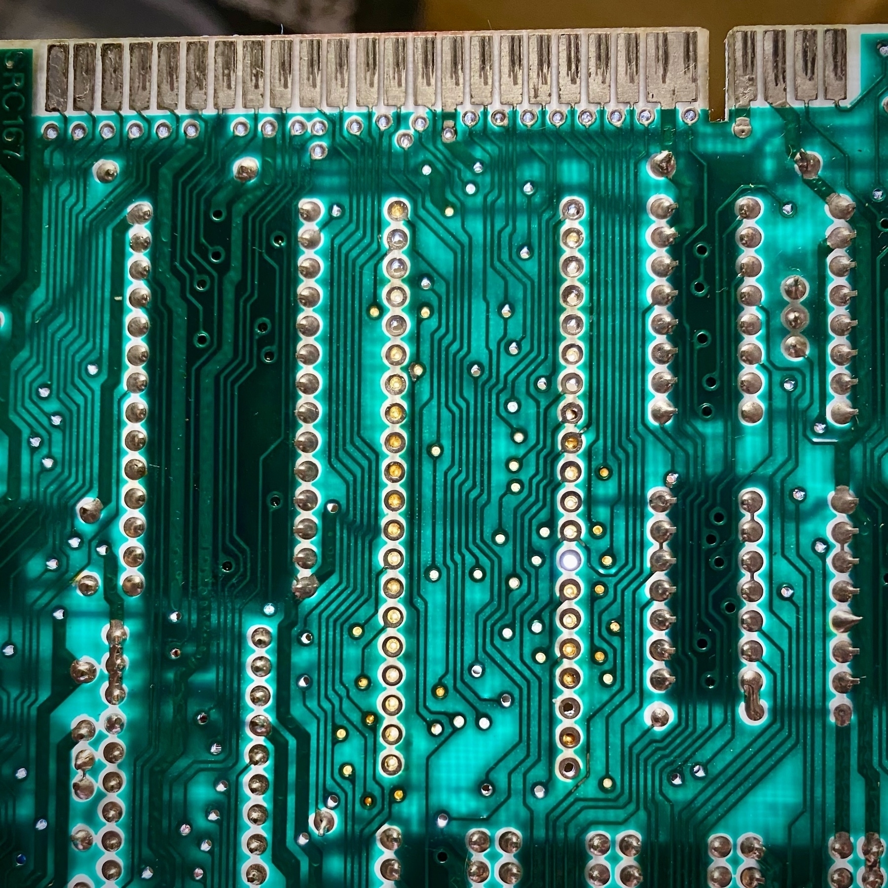 underside of the Spectrum board showing the empty through-holes where the Z80 used to be