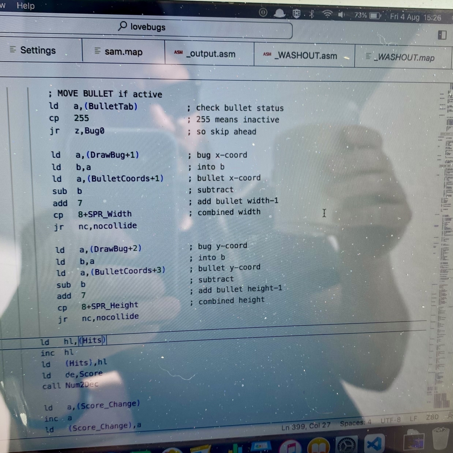 Screenshot of annotated Z80 assembly code that’s designed to detect collisions between game objects, “bullet” and “bug”. Some smug guy can be seen reflected in the glass surface of the computer screen. He might be holding a piña colada.