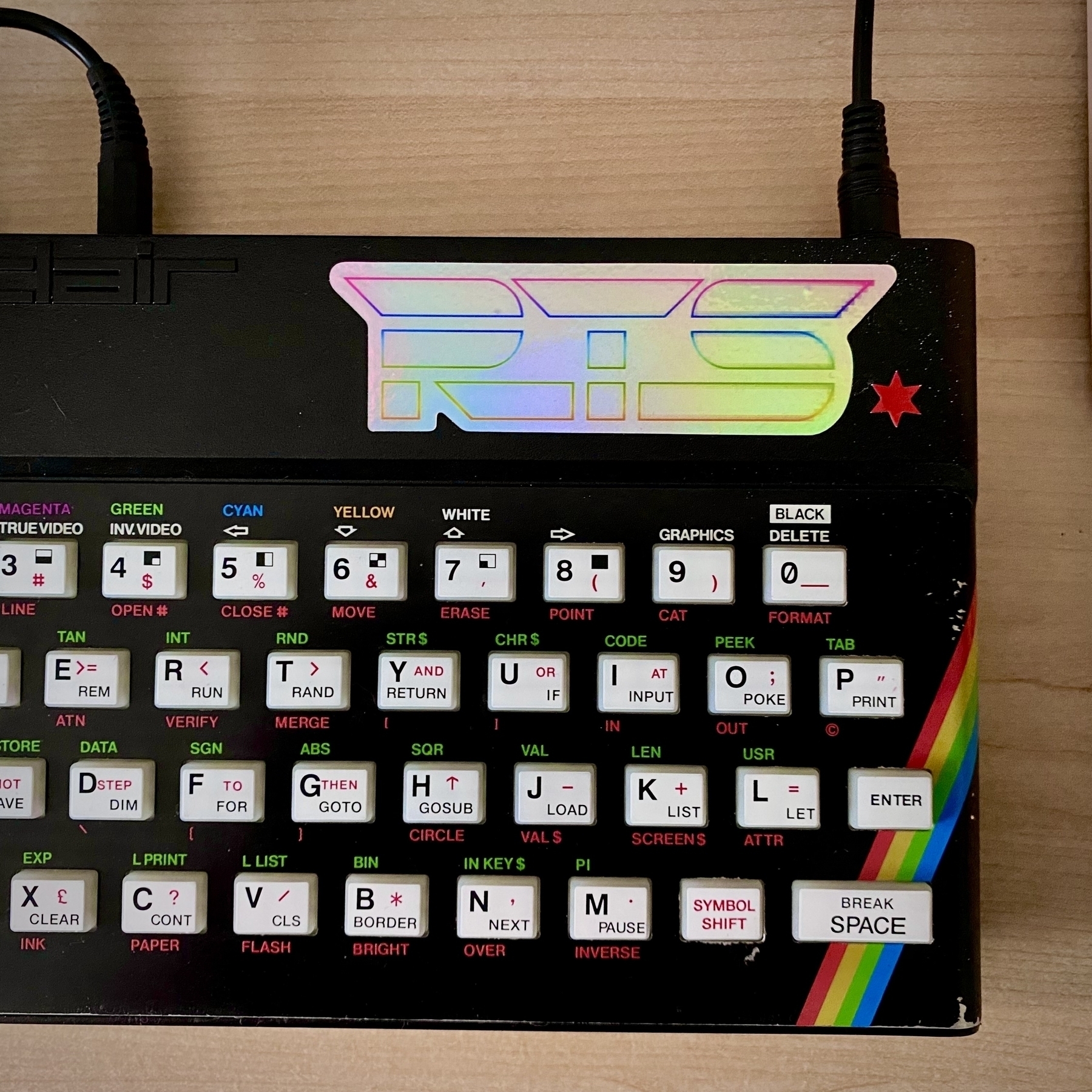 A modified ZX Spectrum with a white key mat and a shiny RTS sticker (see RoseTintedSpectrum on YouTube dot com).