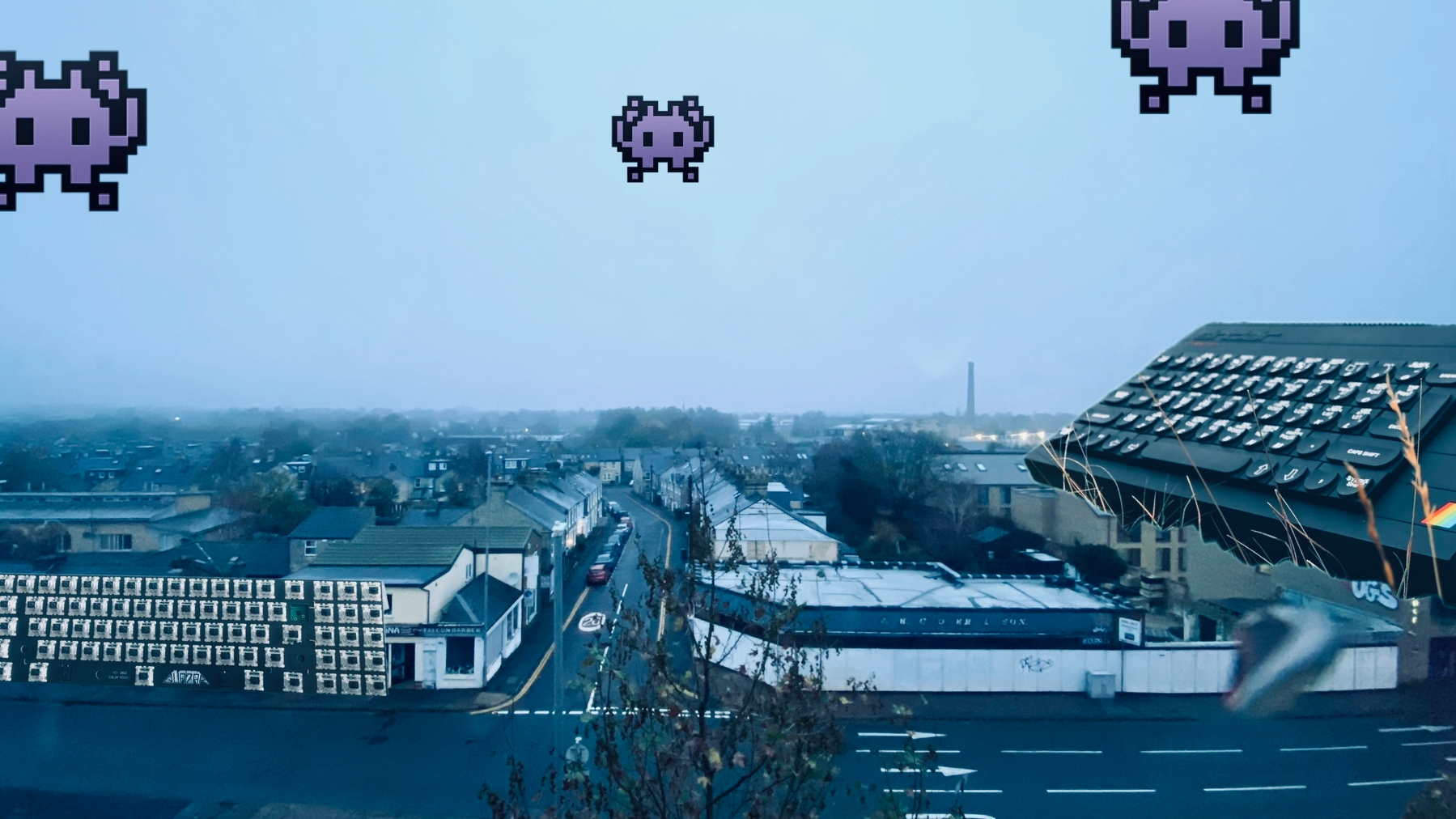 A photograph of a street on a damp November morning. Aliens plummet from the sky apocalyptically but don’t worry because the Earth is defended by a Spectrum+ and a Quazar mechanical keyboard!