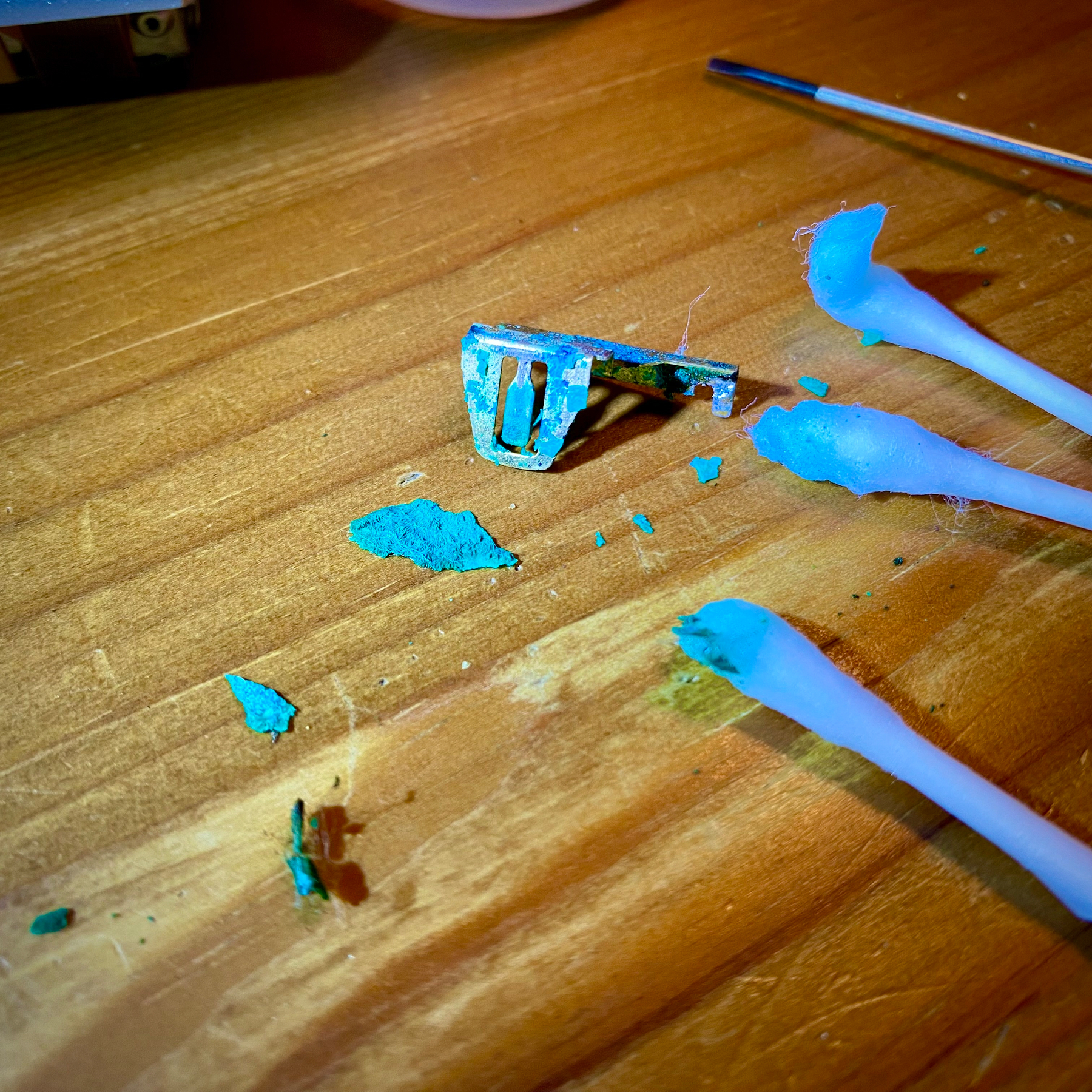 Close up of a very green and upsettingly crusty batter contacts plate. Big chunks of fizzy bogeys are flaking off. 😋