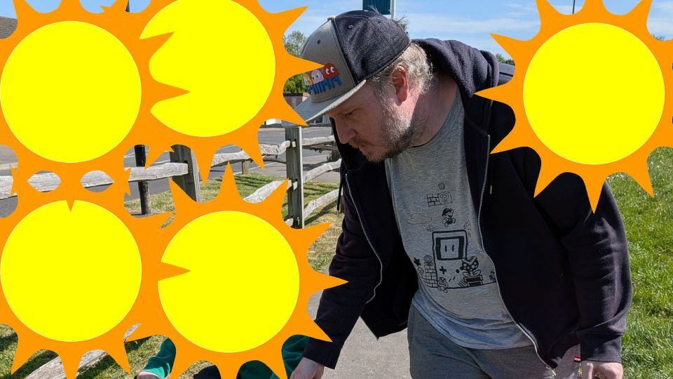 A picture of a man wearing a hat. To the picture some sun emoji have been added.