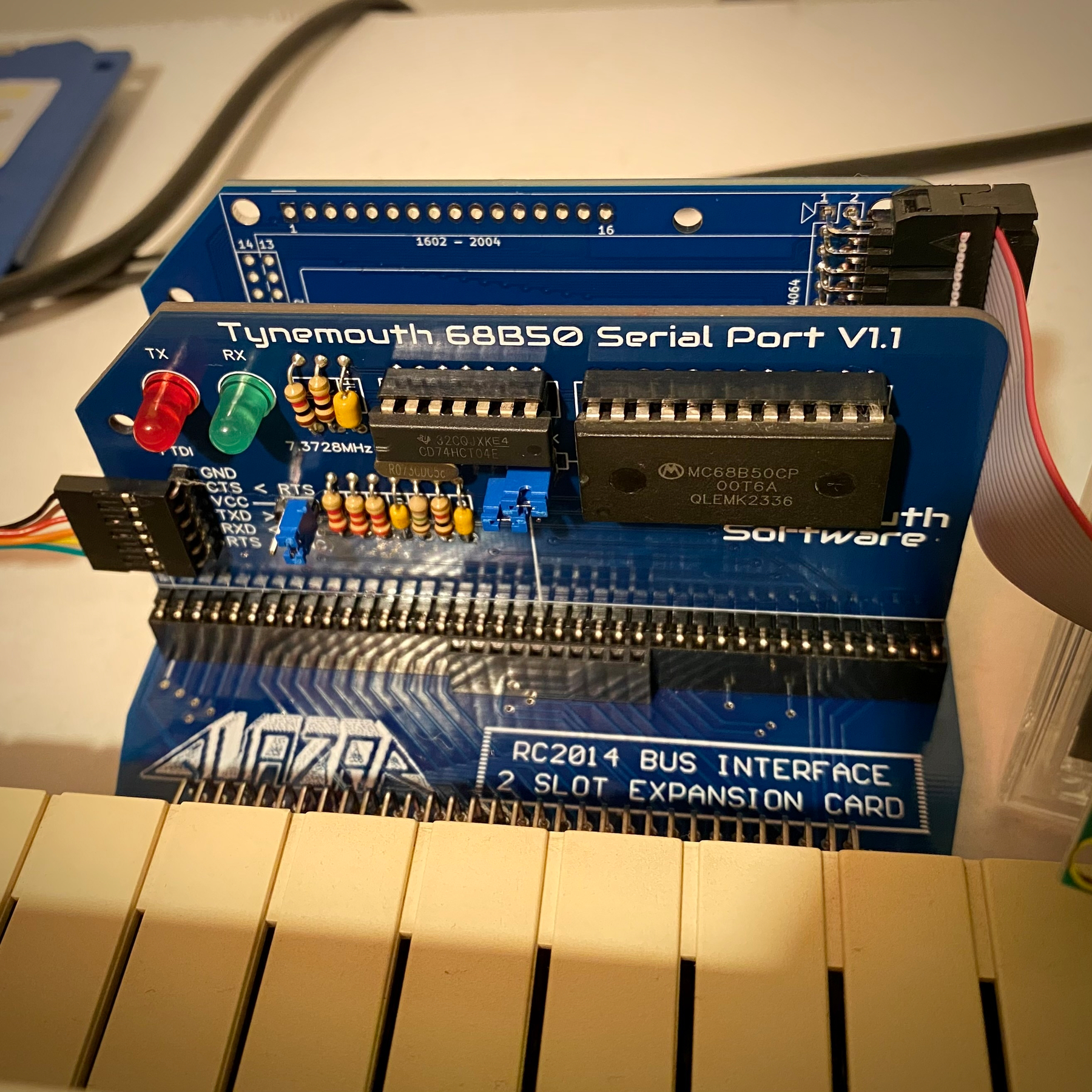 A closer still picture of the serial card, also pictured is the Quazar RC bus expansion card for SAM.