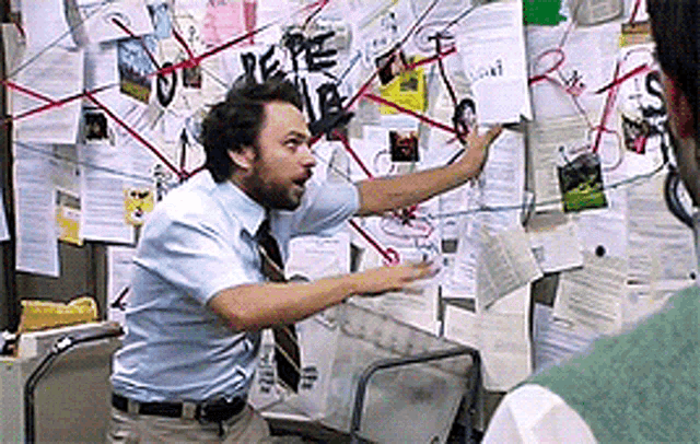 Auto-generated description: Charlie Day conspiracy meme: frantically pointing at a chaotic, string-covered, white board.