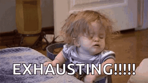 Auto-generated description: A tired-looking child with disheveled hair appears to be leaning on a surface, accompanied by the caption EXHAUSTING!!!!!