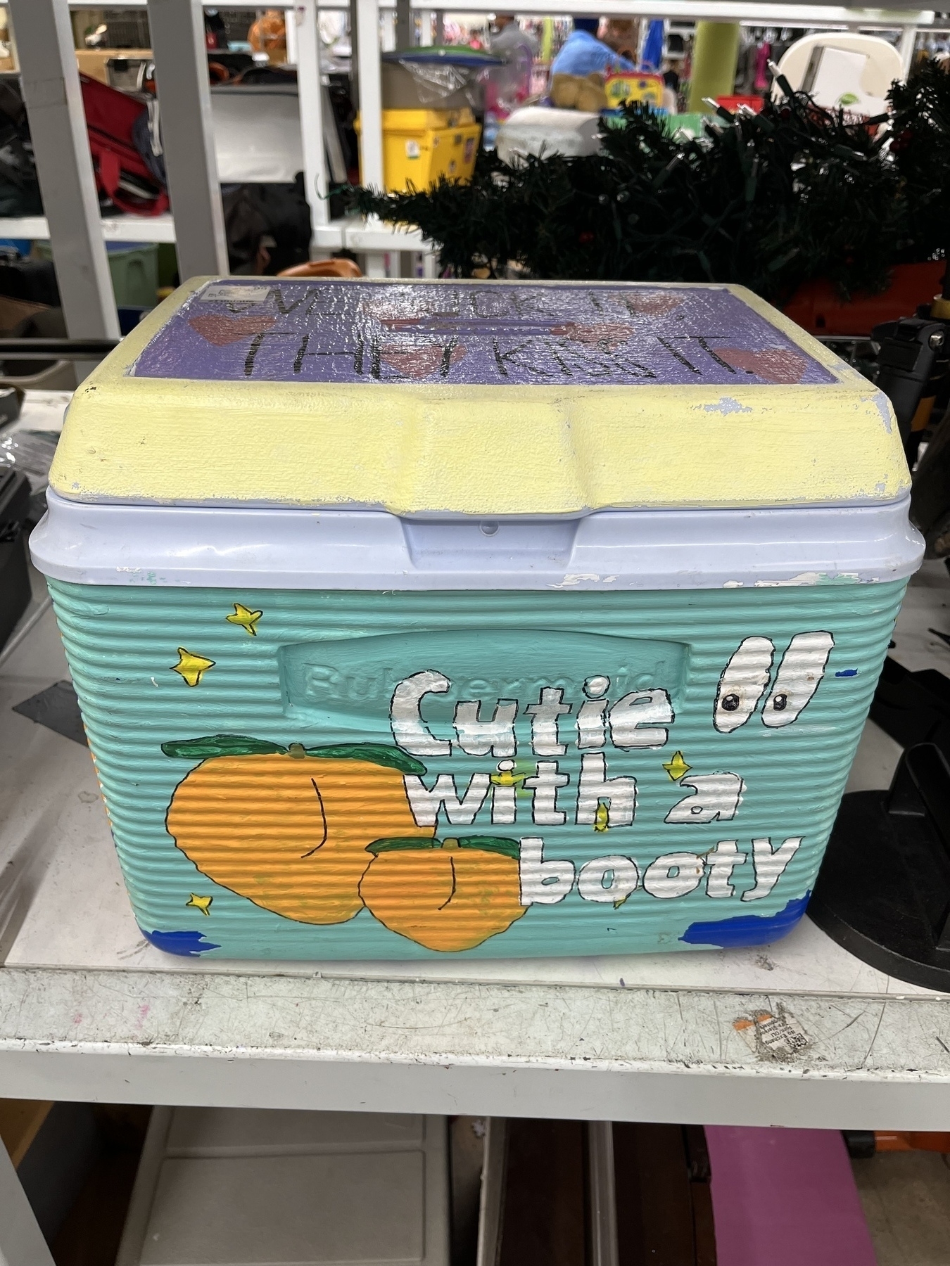 Cooler with hand painted words saying “Cutie with a Booty.” 👀