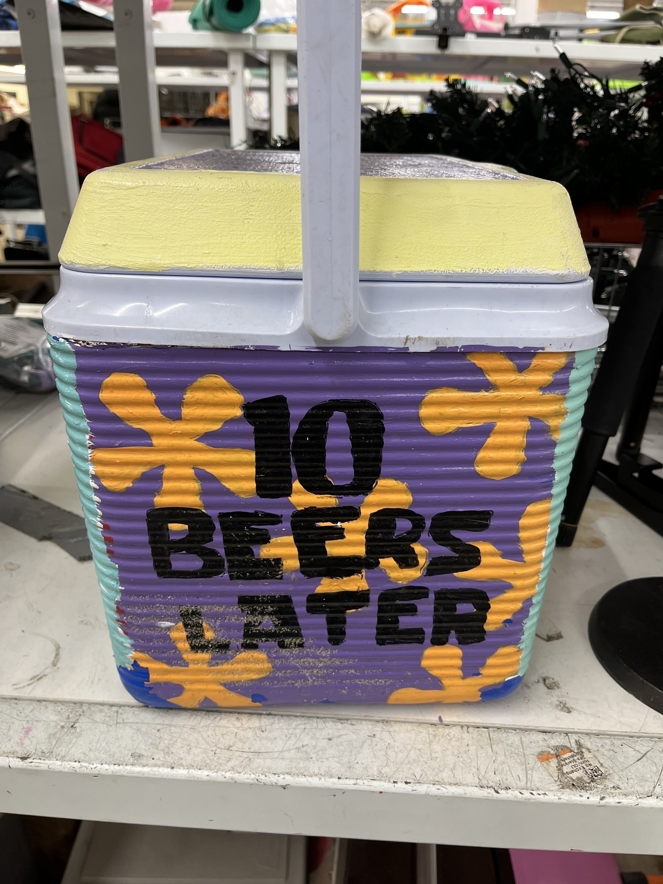 Hand painted side of cooler saying 10 beers later in a sponge bob “three hours later” meme style. 