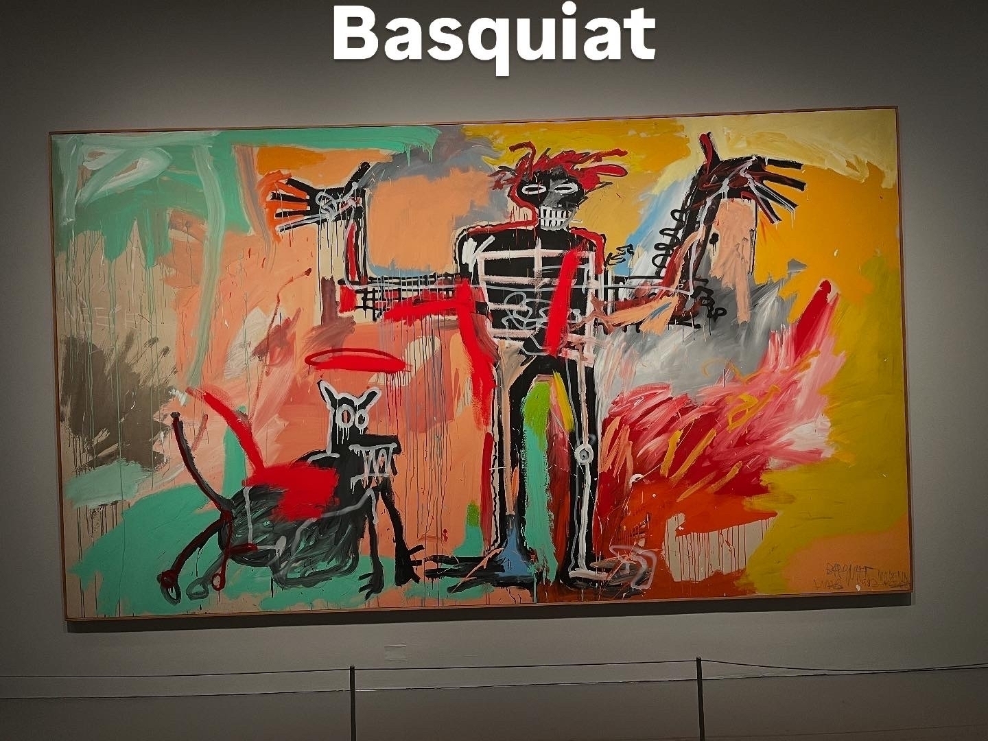 A vibrant, abstract painting features a skeletal figure with outstretched arms alongside a dog-like creature. The background is a chaotic mix of bold colors. Text: “Basquiat” at the top.