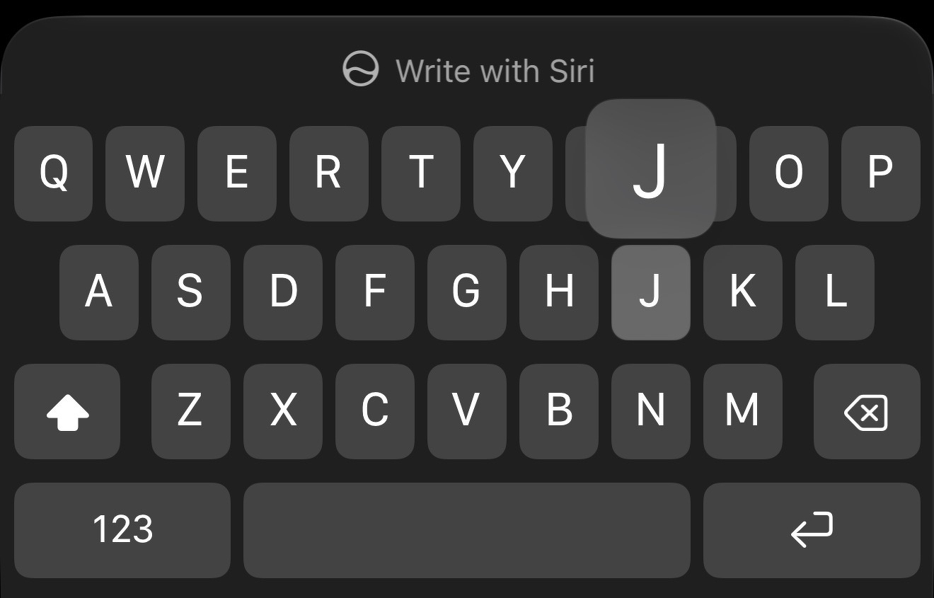 A dark-themed virtual keyboard is displayed with the letter J highlighted.