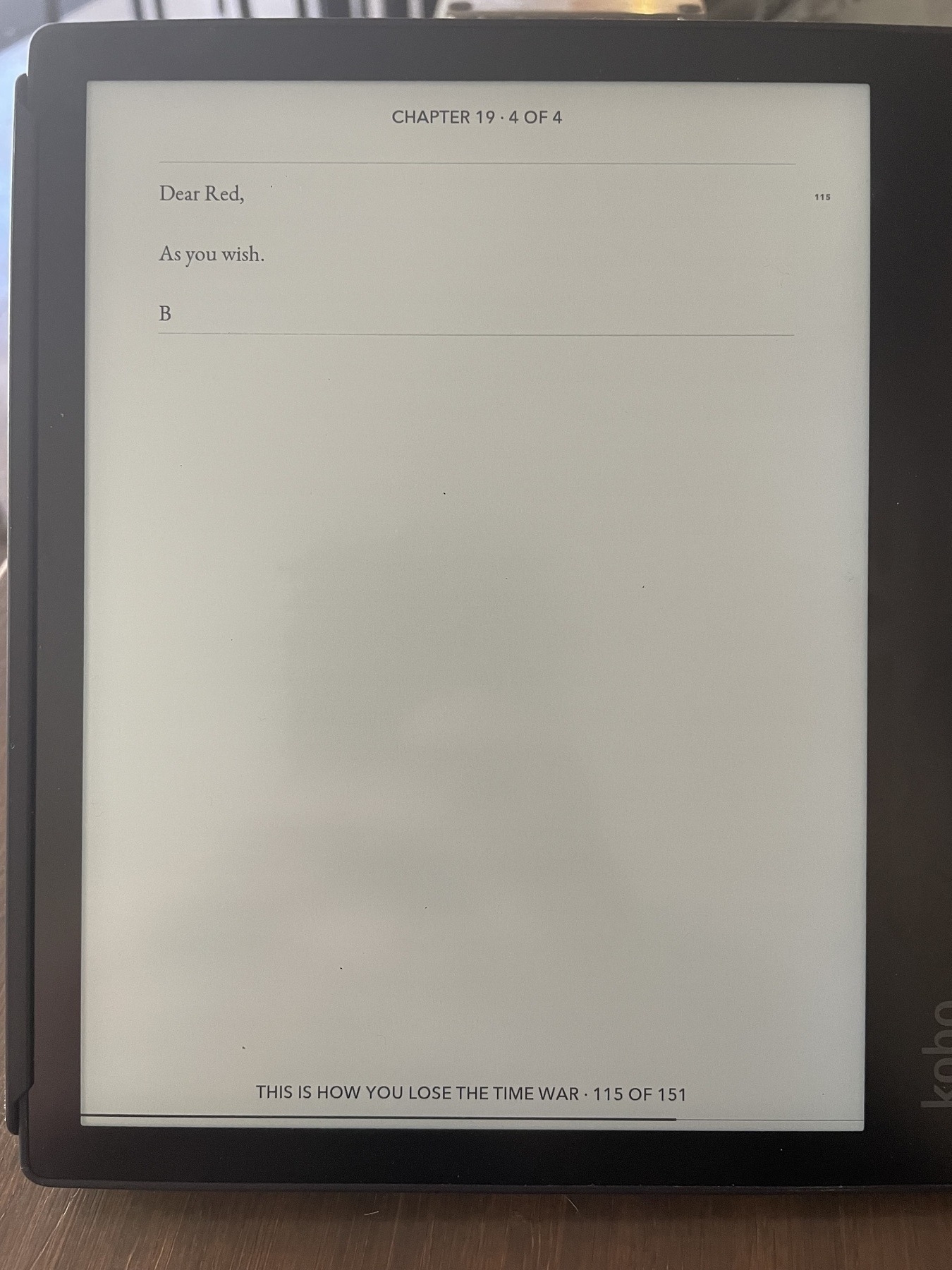 An e-reader screen showing the 115th page of _This Is How You Lose The Time War_, with a passage in the form of a letter: “Dead Red, As you wish. B”. 