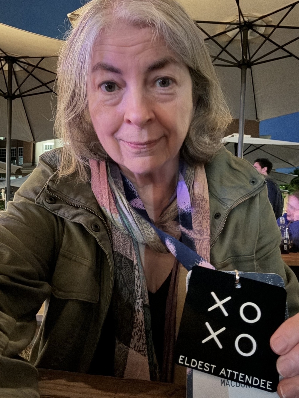 Me with a black xoxo badge that reads Eldest Attendee.