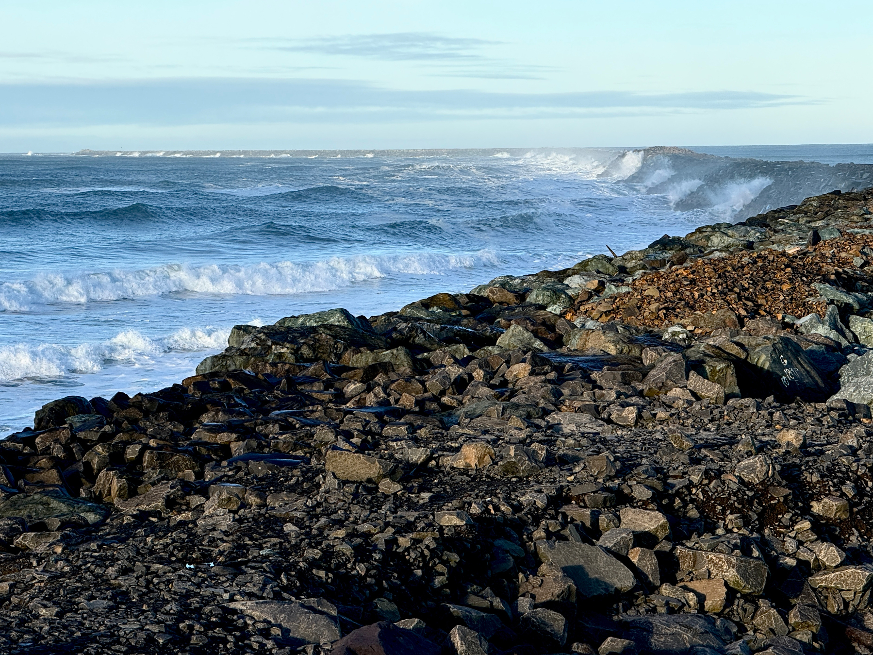 Rocky jetty and ocean waves