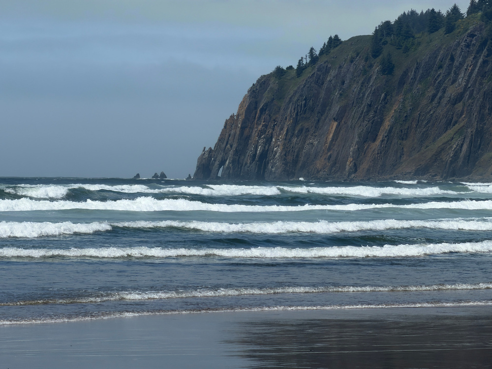 Ocean waves and mountain cliff