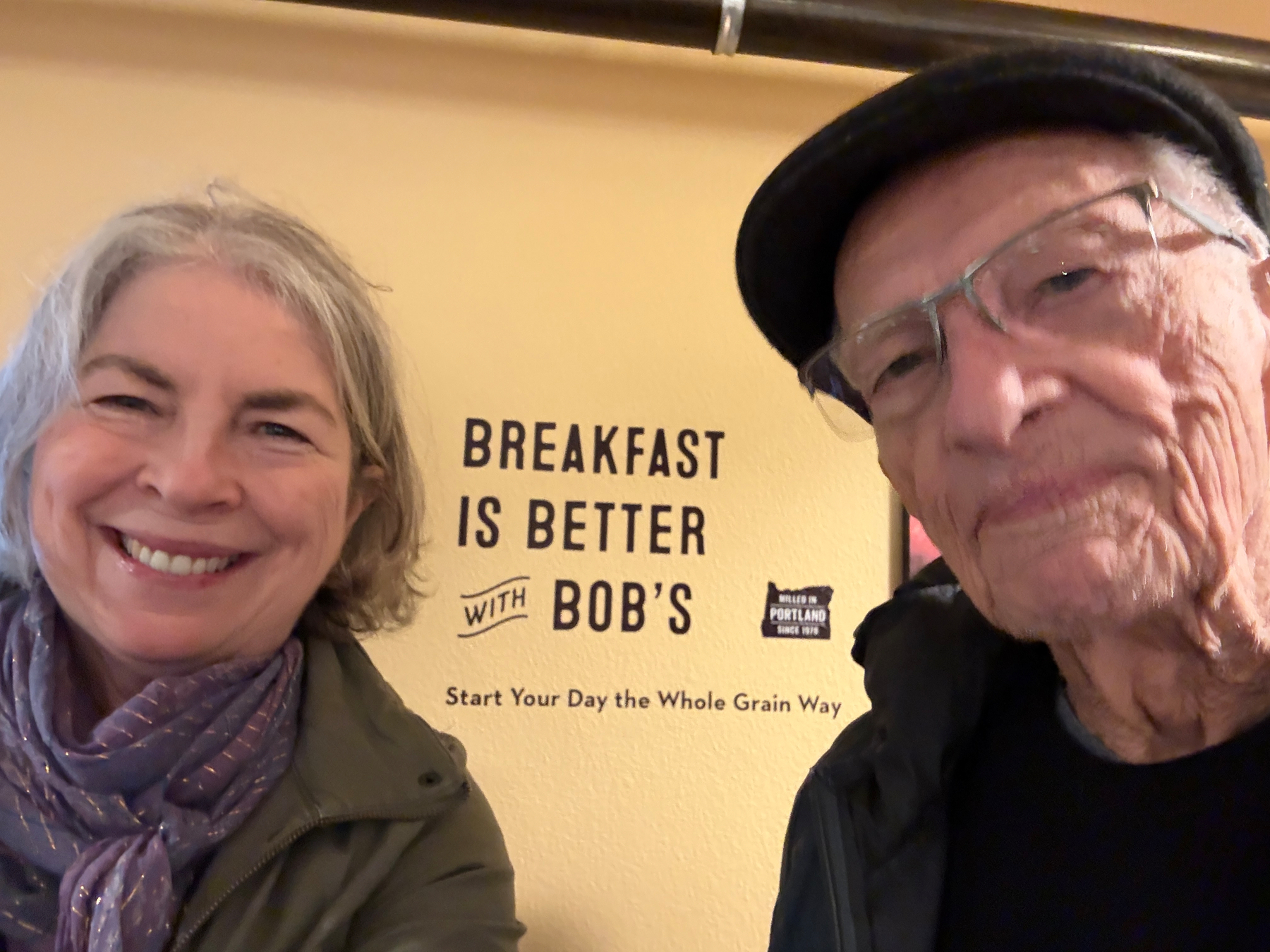 My dad and me by the sign “Breakfast is better with Bob’s.”