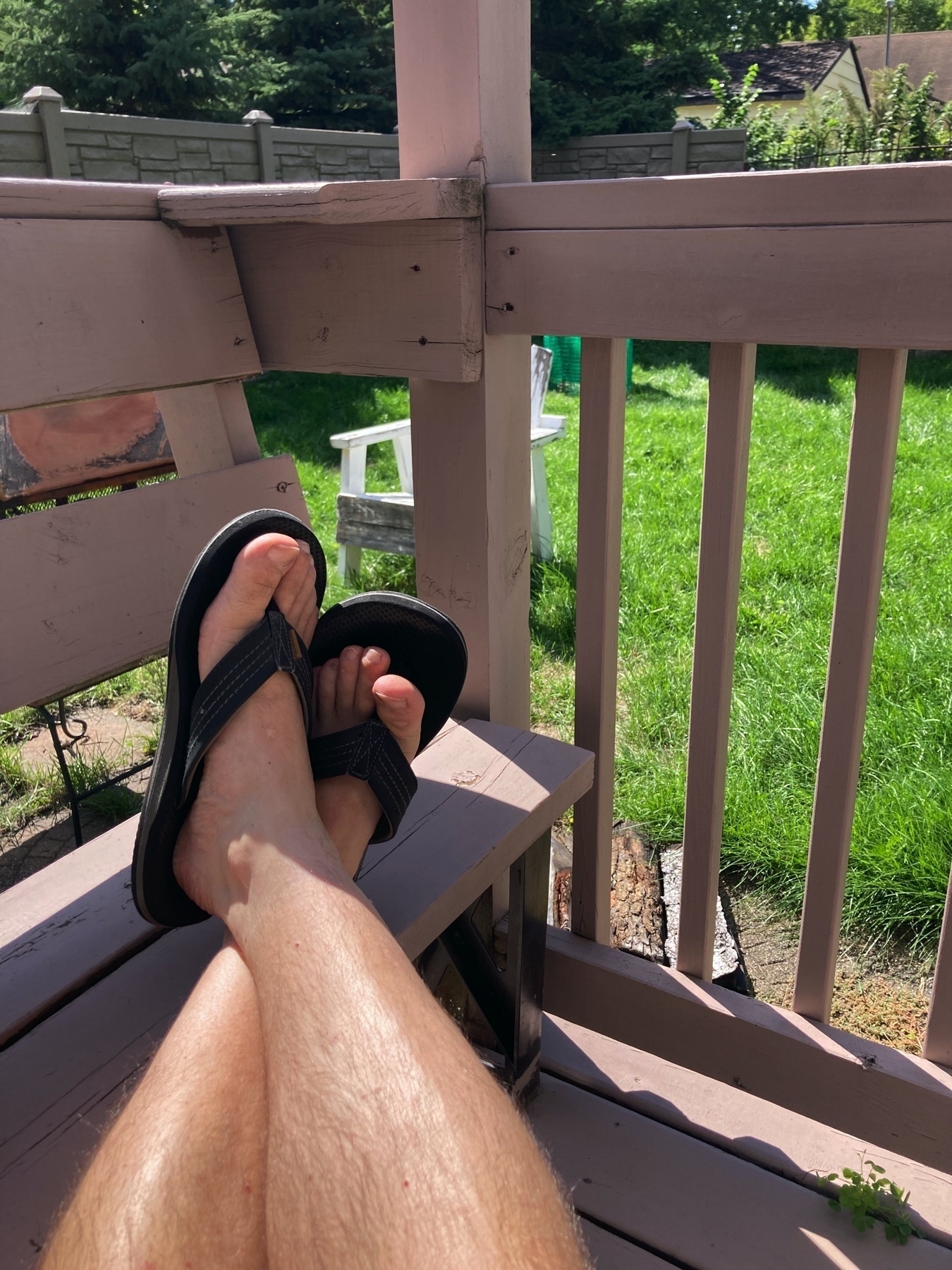 Feet up in flip flops on the back deck