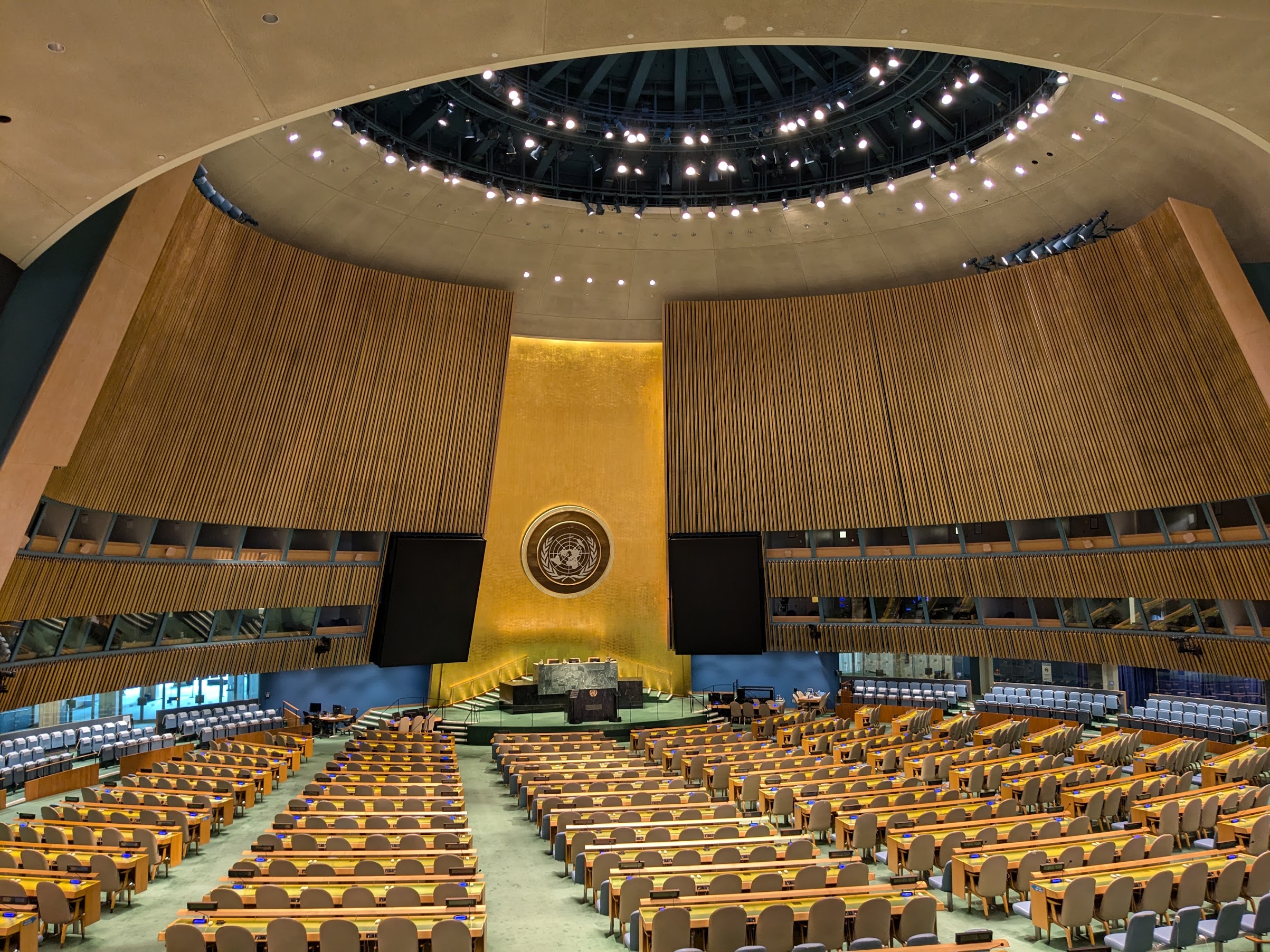 The United Nations General Assembly Hall, with its green marble podium and golden emblem