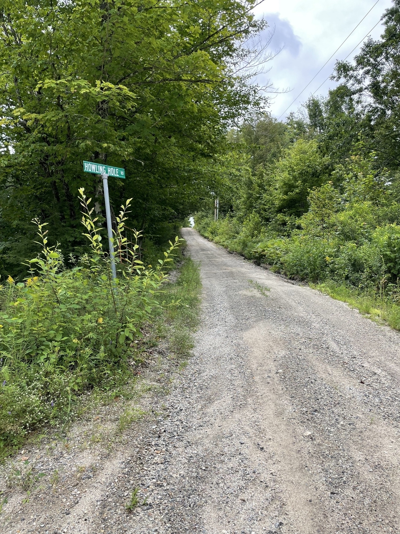 Street sign on gravel road