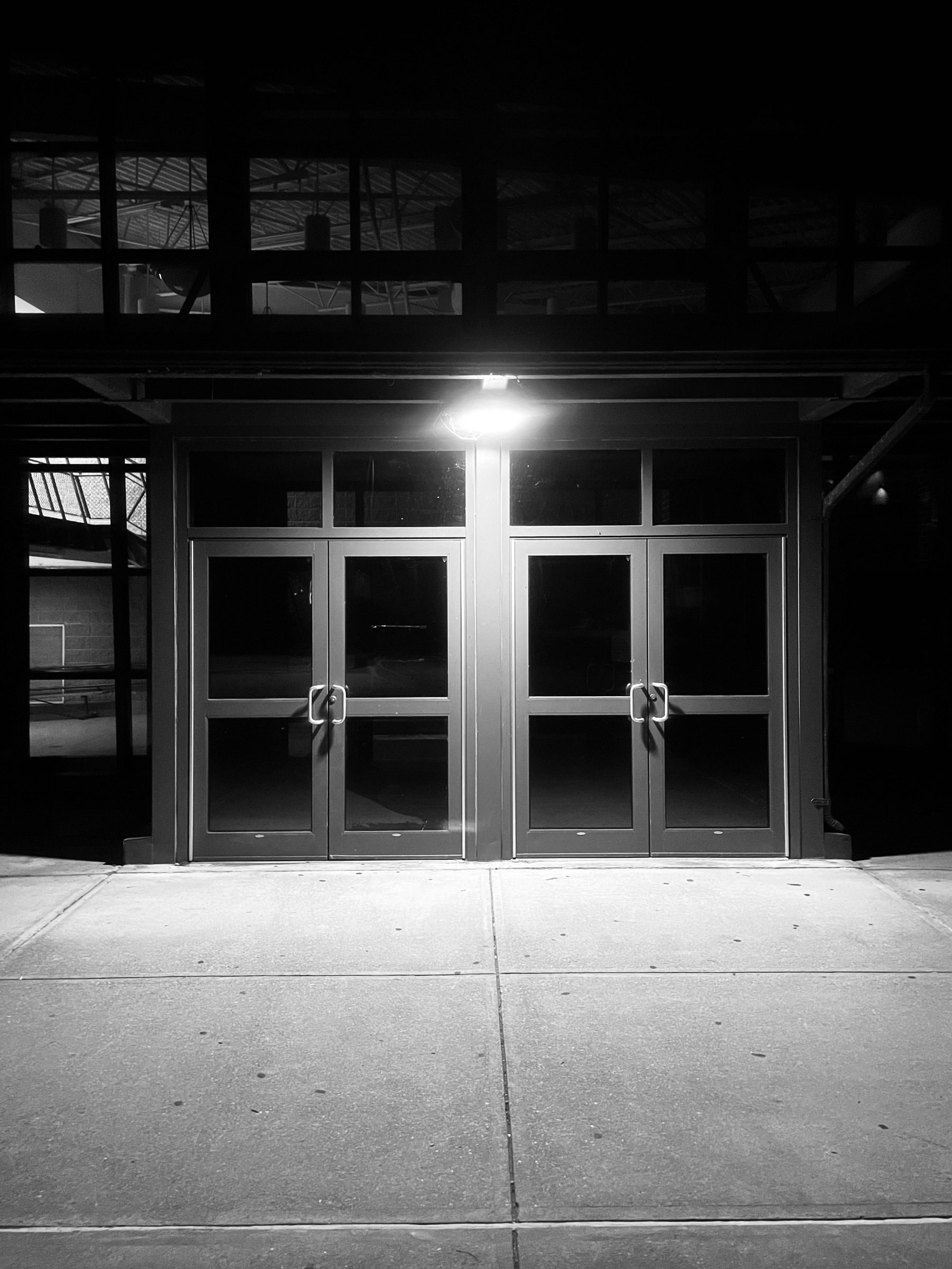 Doors to the middle school, after dark