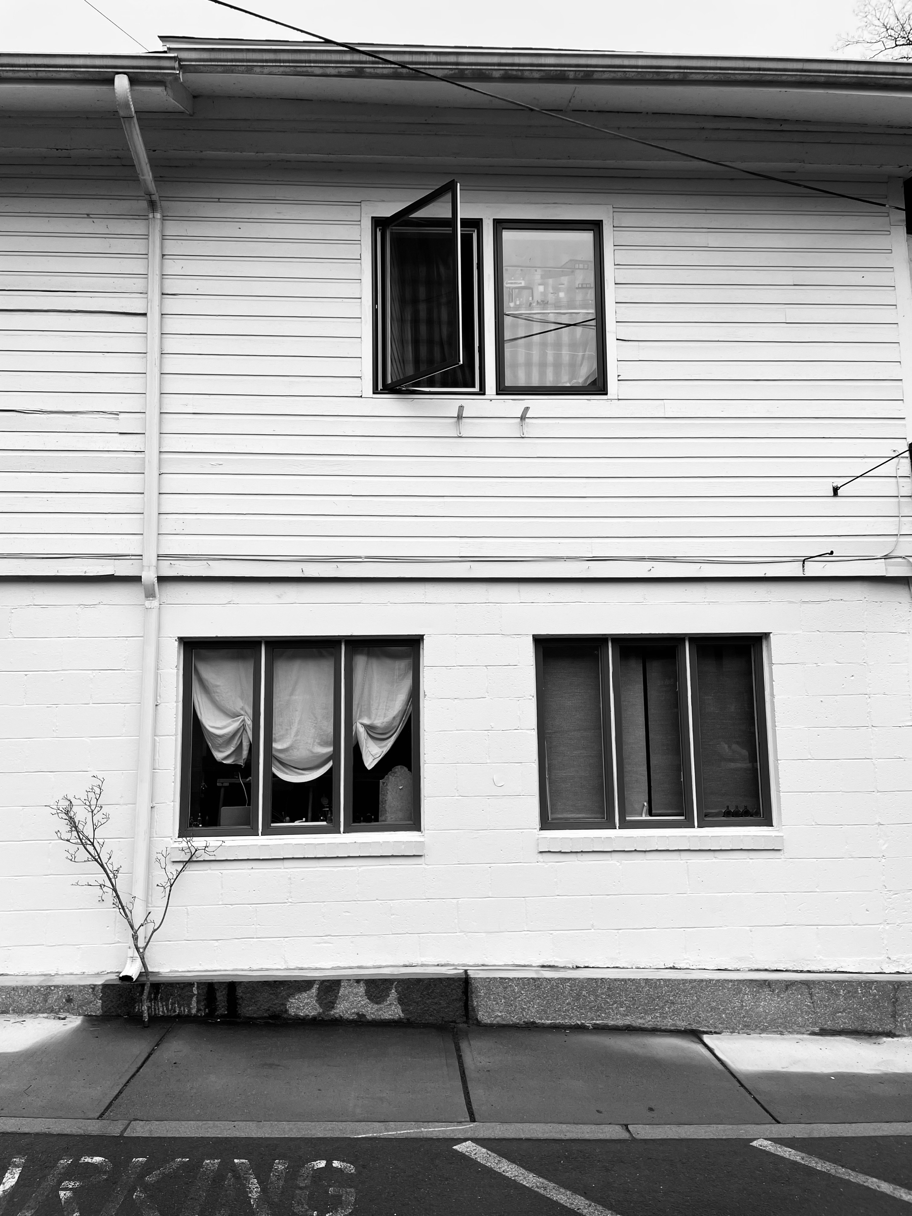 Three windows on a wall in Shelburne Falls, MA