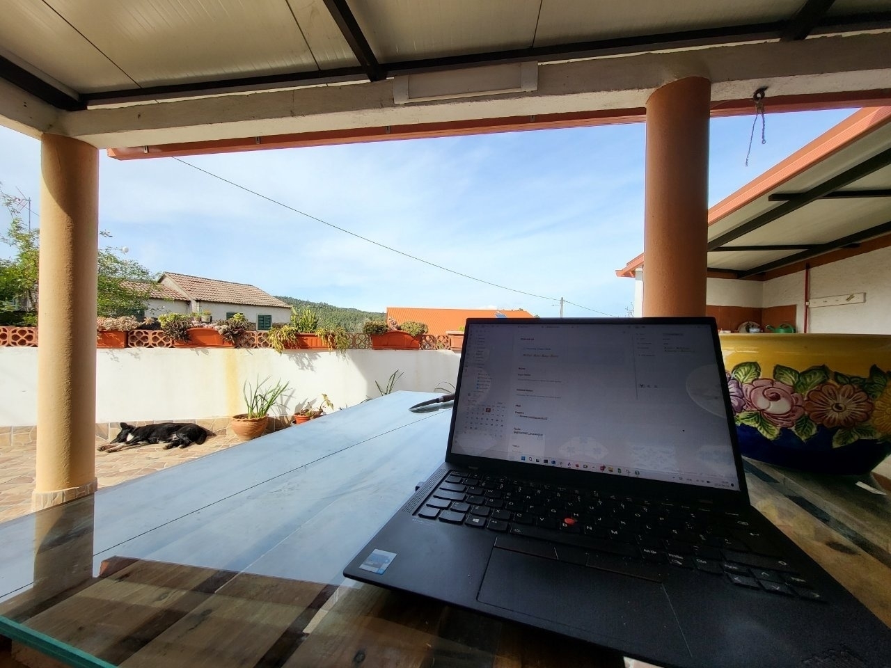 Laptop over a table on a terrace 