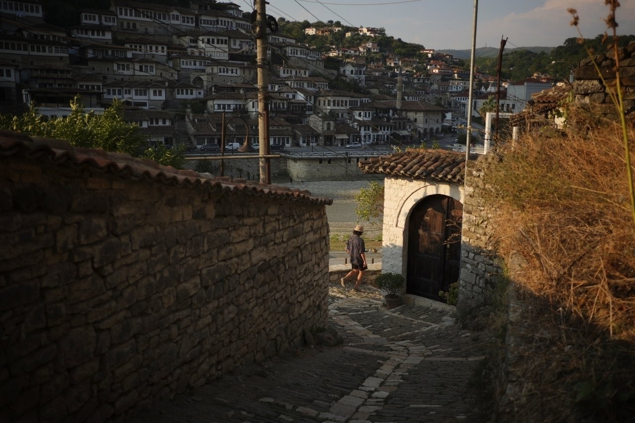 Tourist going down an alley in Gorica neighborhood 