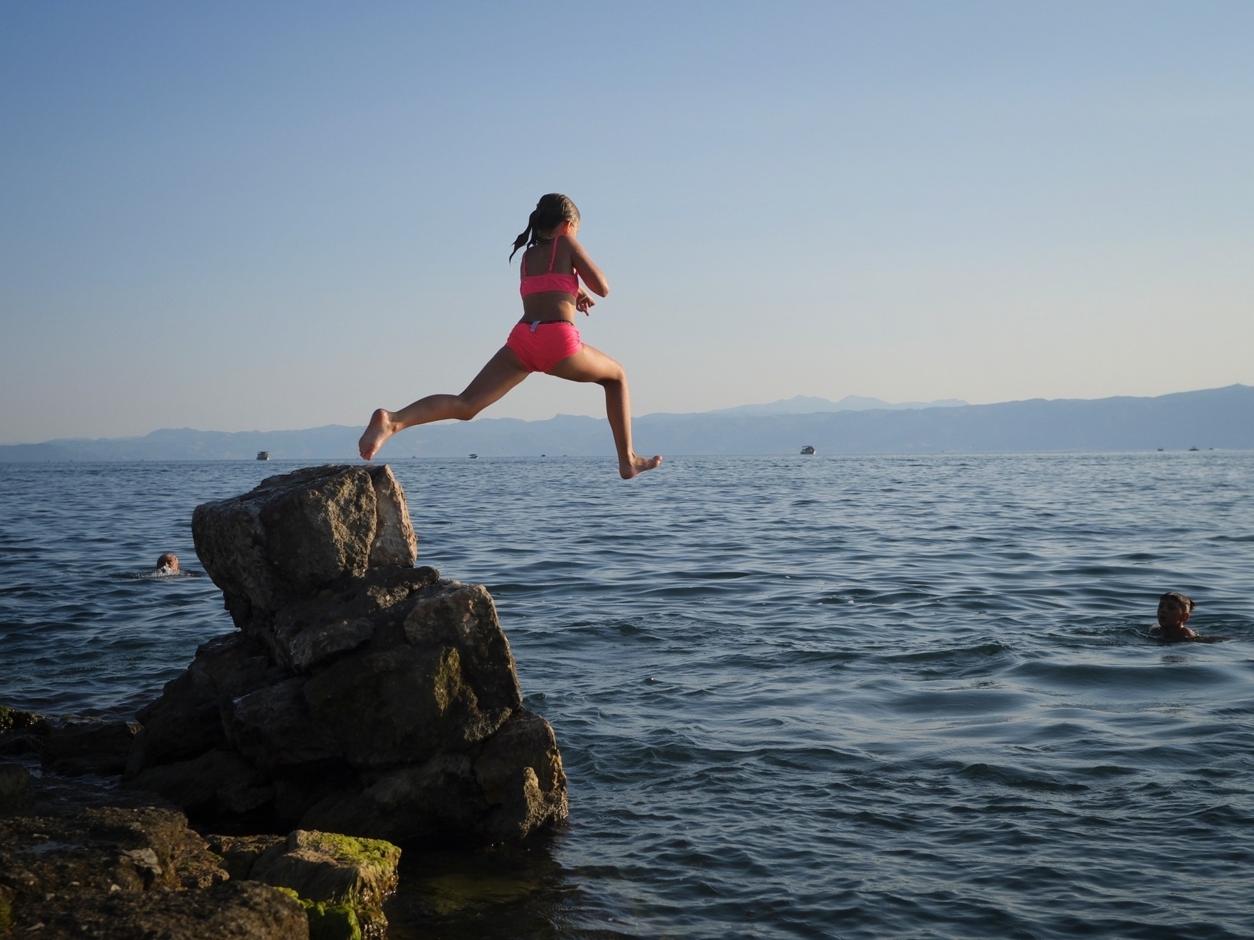 Girl jumping to the water in Ohrid 