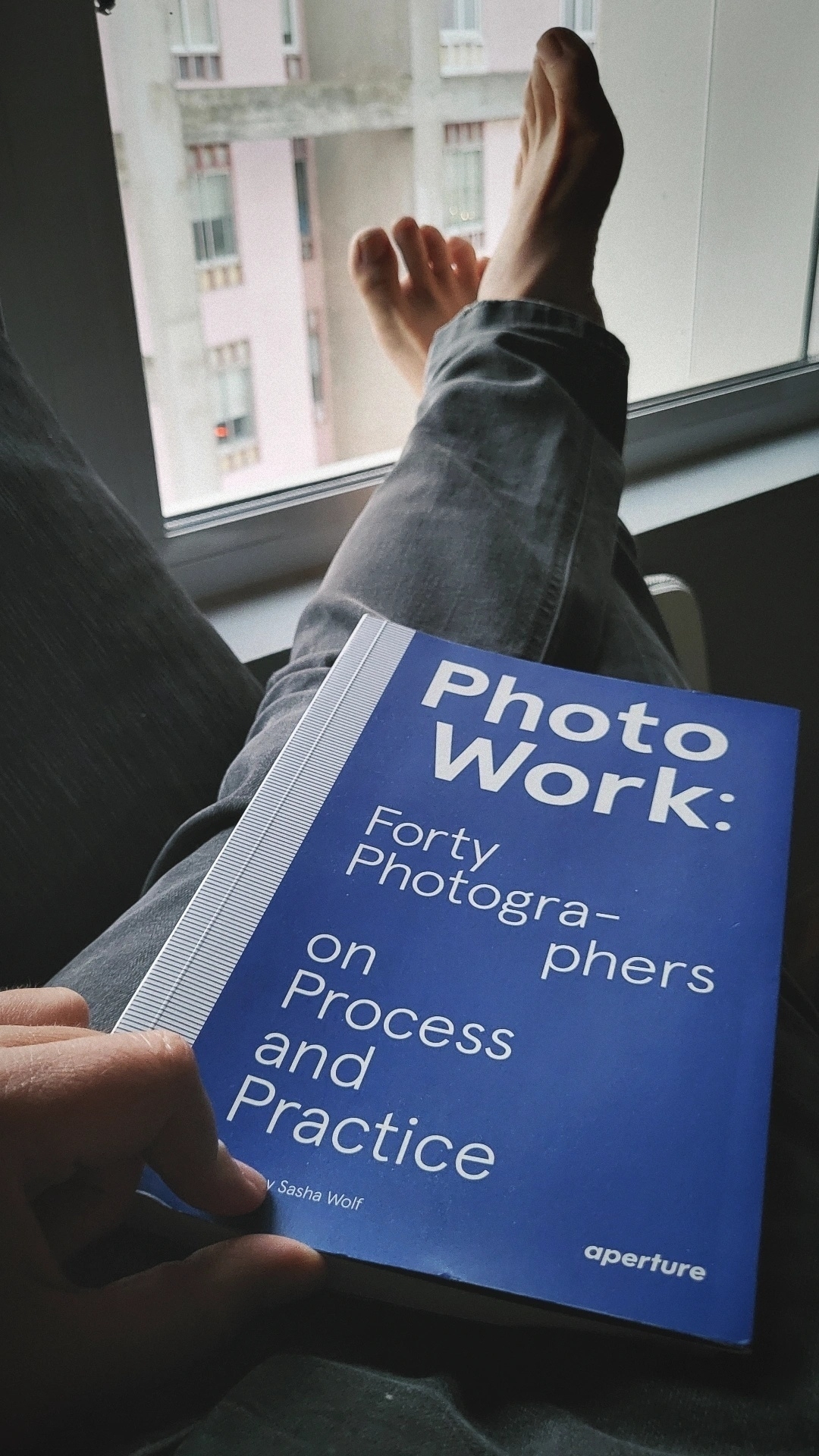 Holding book "Forty photographers, on process and practice" 