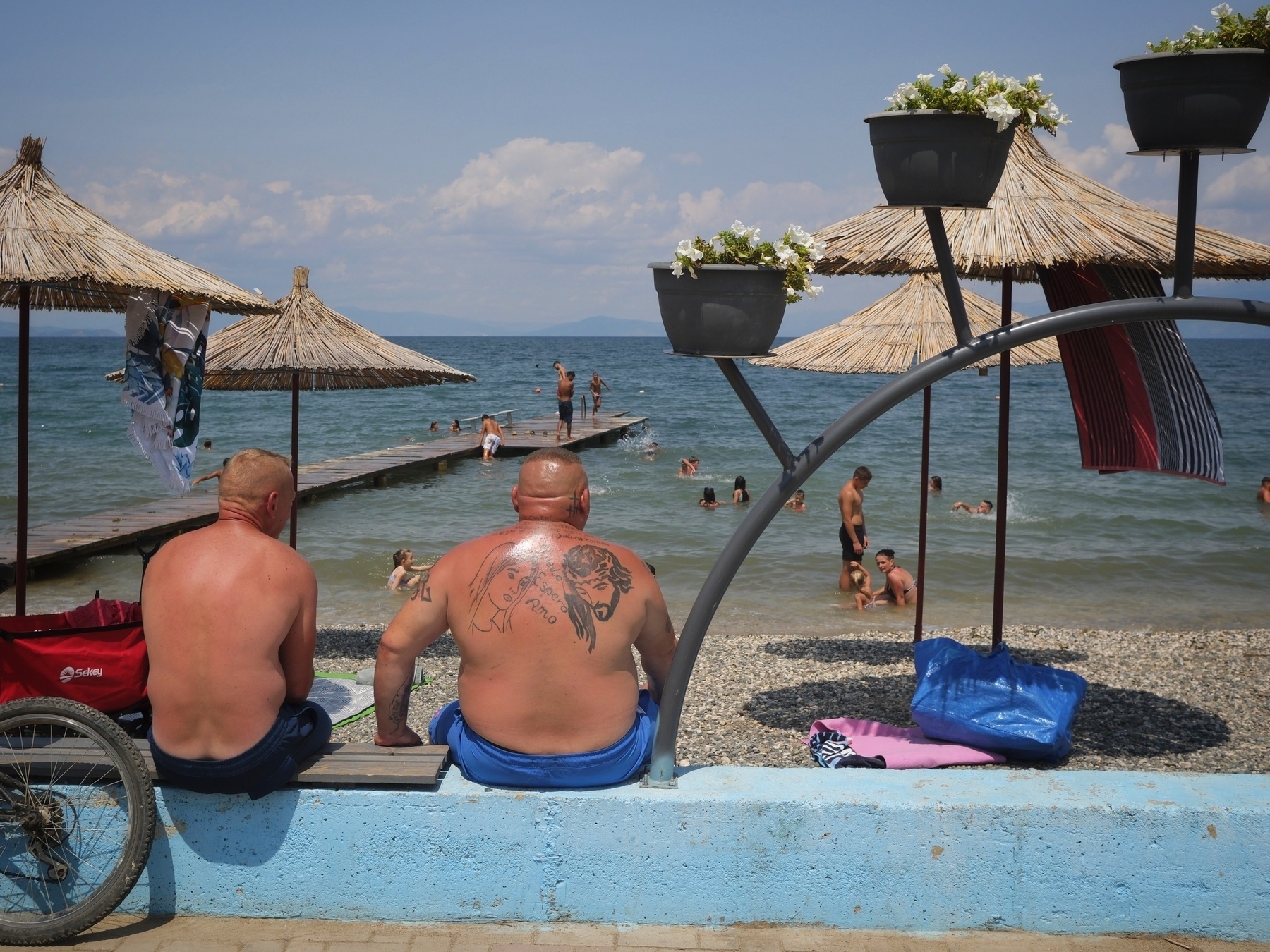 Boy buried in sand at Pogradec 