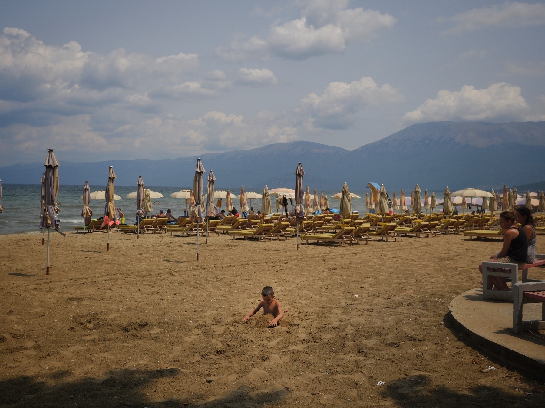 Beach goers by the waterfront in Ohrid