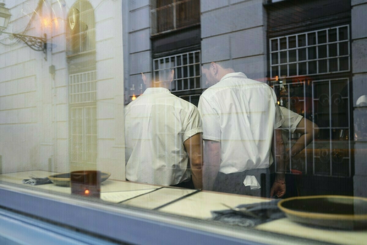 Waiters in restaurant from window