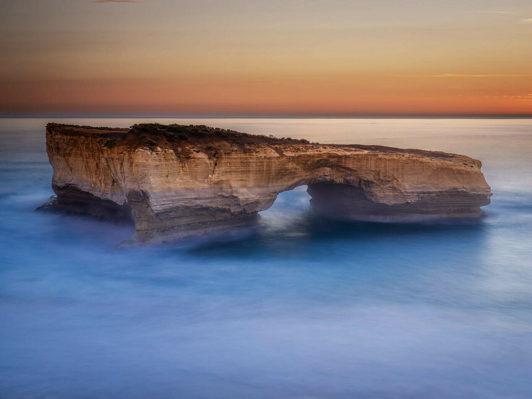 Sunset image of London Arch, a wonderful sea stack along the Great Ocean Road in Victoria, Australai