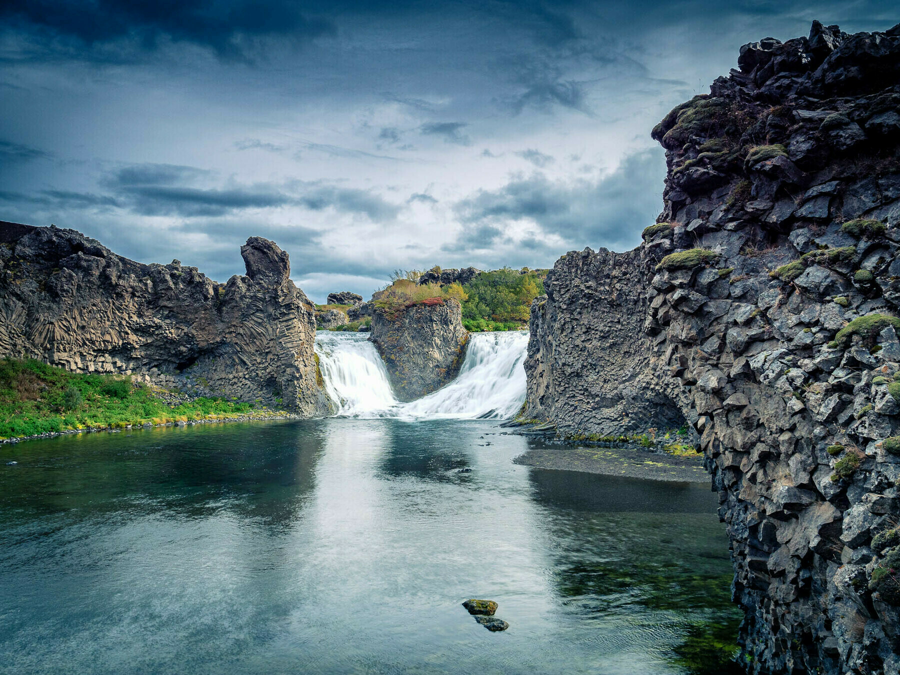 Image of Hjálparfoss—a double waterfall in the Icelandic Highlands.