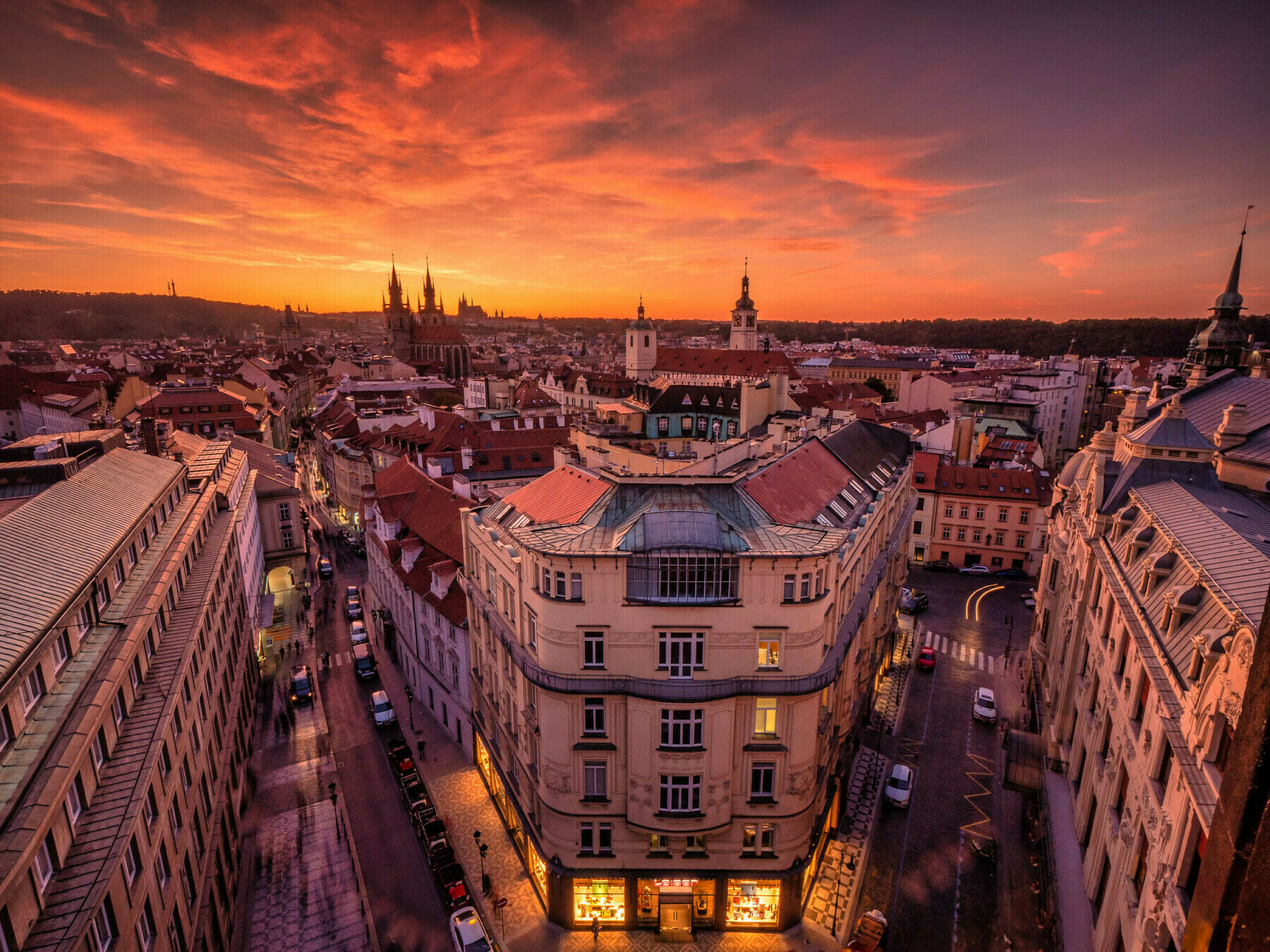 A spectacular sunset cityscape of Prague captured from Powder Gate with views to the distant cathedral and castle.