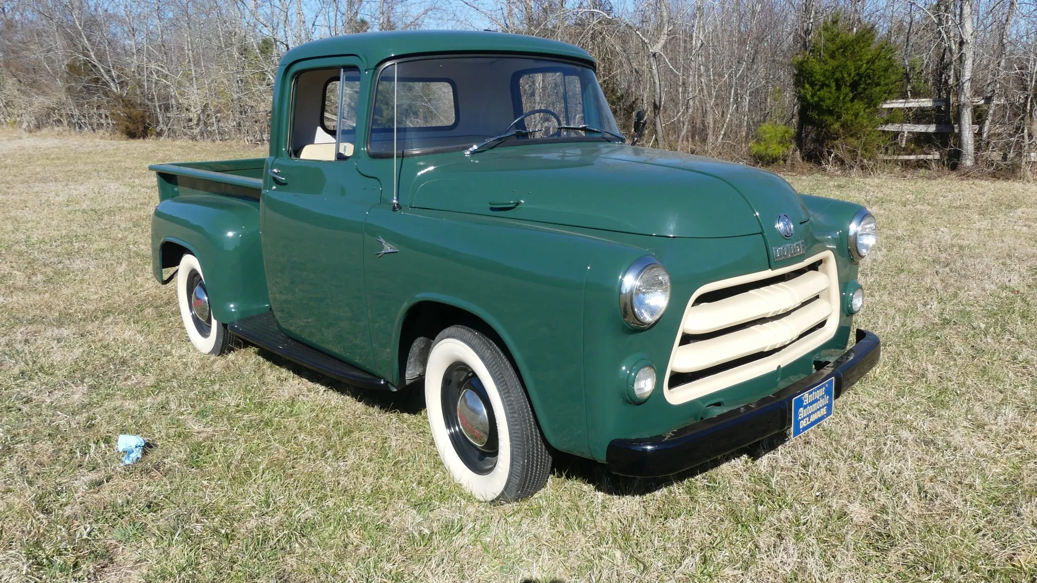  1956 Dodge with cream accents on the grill and all green body