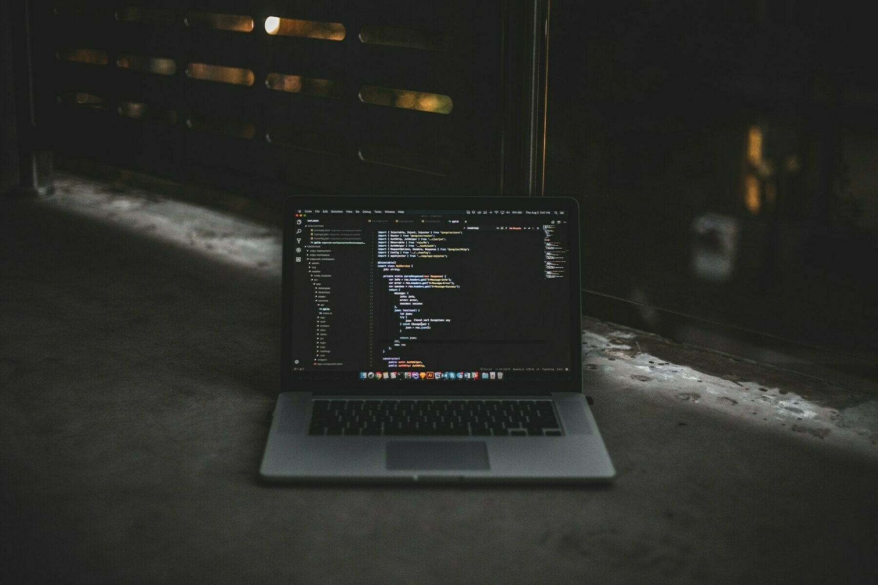 Photo of MacBook Pro in a gray room, by Blake Connally on Unsplash