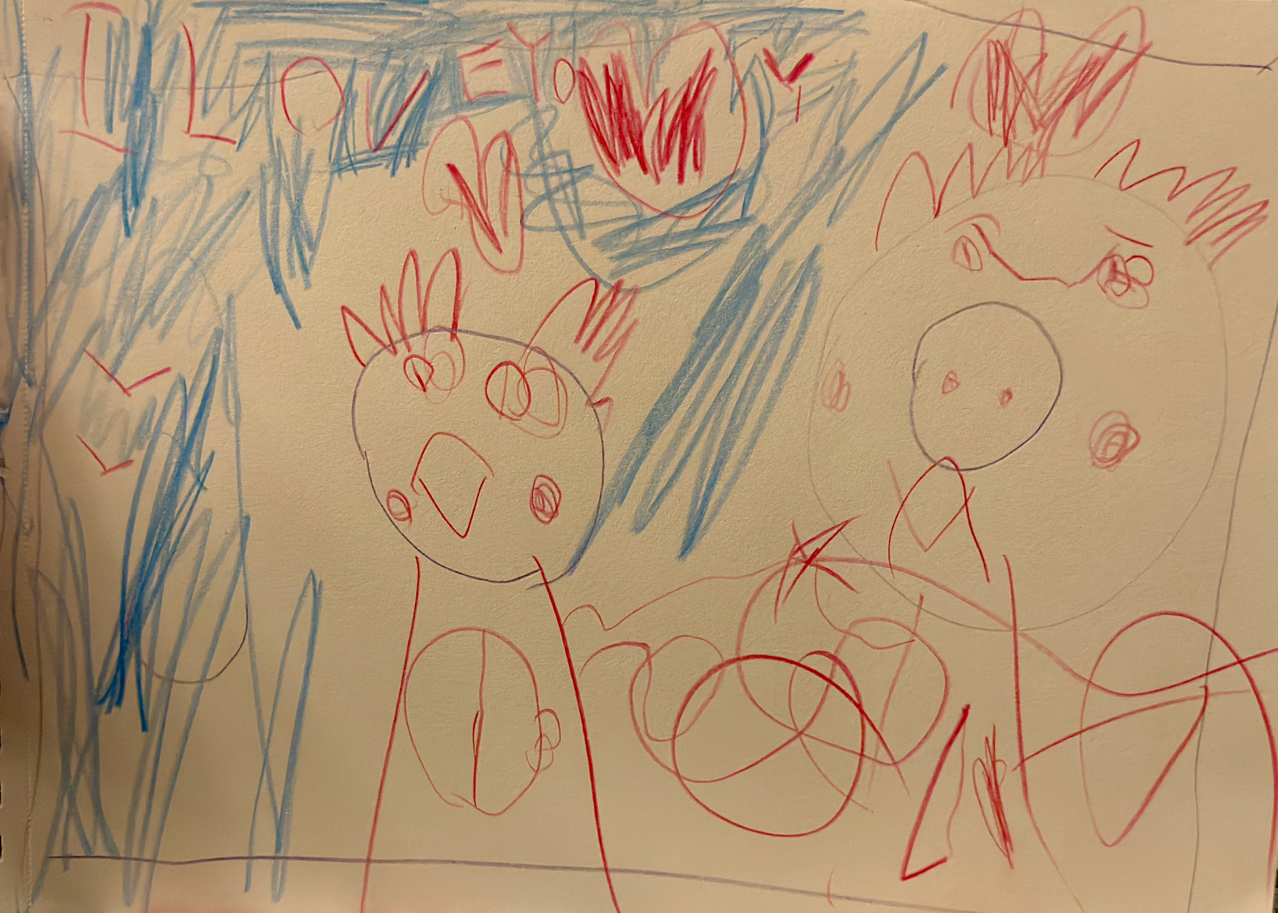 Auto-generated description: Childlike drawings feature colorful scribbles and abstract figures in red and blue crayon with handwritten text at the top.