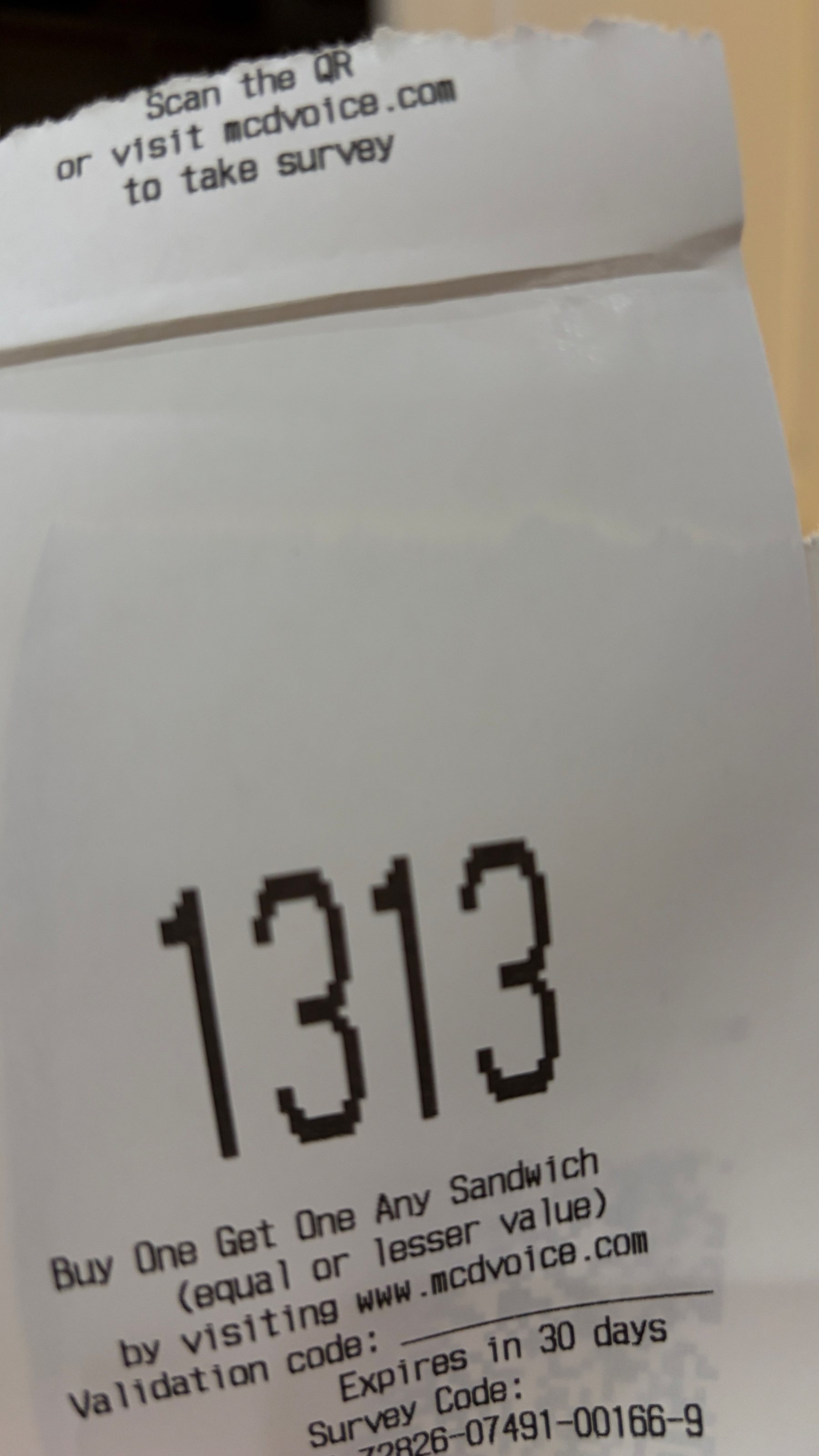 a receipt with “1313” printed in large numerals at the top
